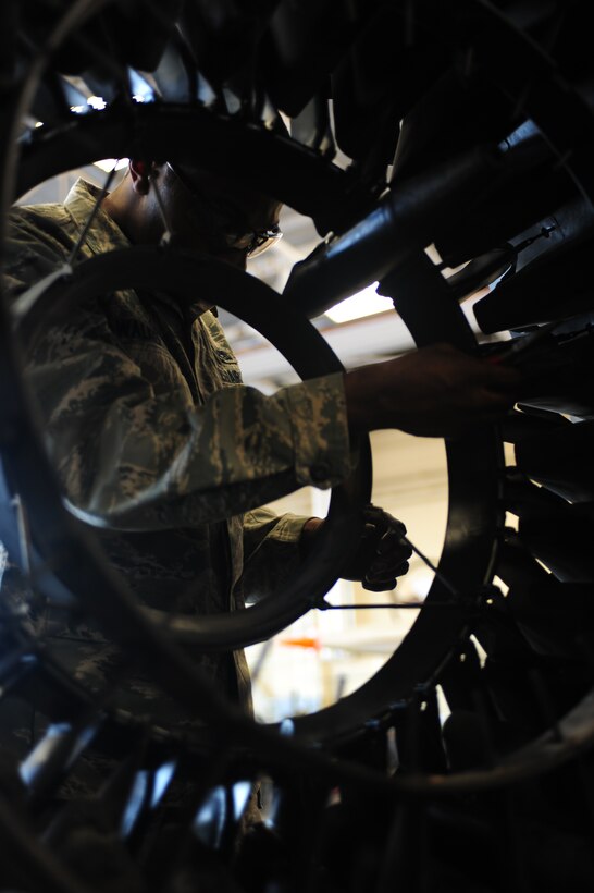 ELLSWORTH AIR FORCE BASE, S.D. --  Airmen 1st Class Kymric Walker, 28th Maintenance Squadron aerospace propulsion maintenance apprentice, removes S-pins inside the augmenter flame holder from a B-1B Lancer engine, Feb 3.  While working inside the augmenter flame holder, Airman Walker ensures his eyes are protected through the use of proper protective equipment. (U.S Air Force photo/Airman 1st Class Anthony Sanchelli)