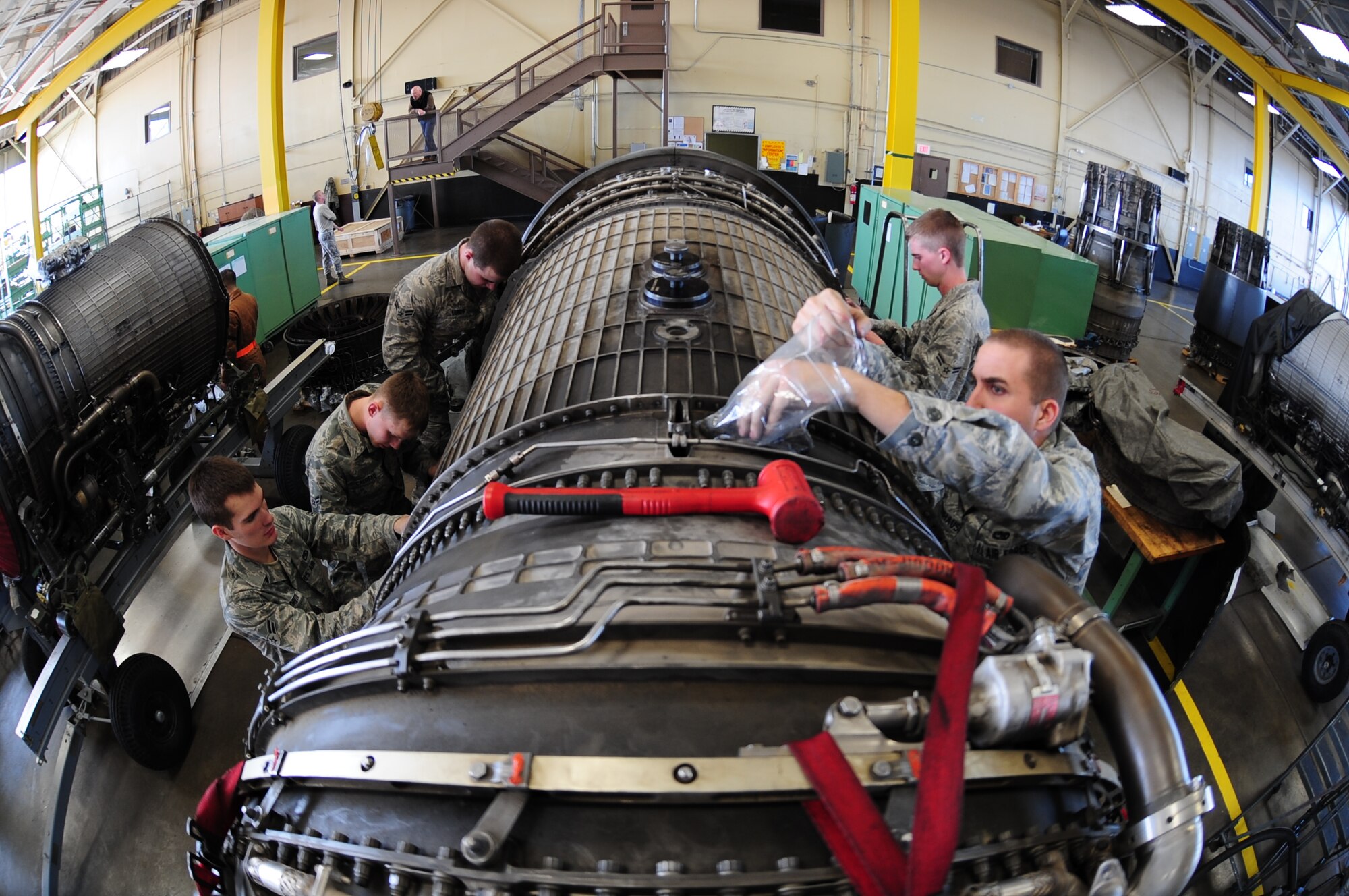 ELLSWORTH AIR FORCE BASE, S.D. -- Aerospace propulsion Airmen from the 28th Maintenance Squadron work on a B-1B Lancer engine, Feb 3.  Carrying the largest payload of both guided and unguided weapons in the Air Force inventory, the multi-mission B-1 is the backbone of America's long-range bomber force. (U.S Air Force photo/Airman 1st Class Anthony Sanchelli)