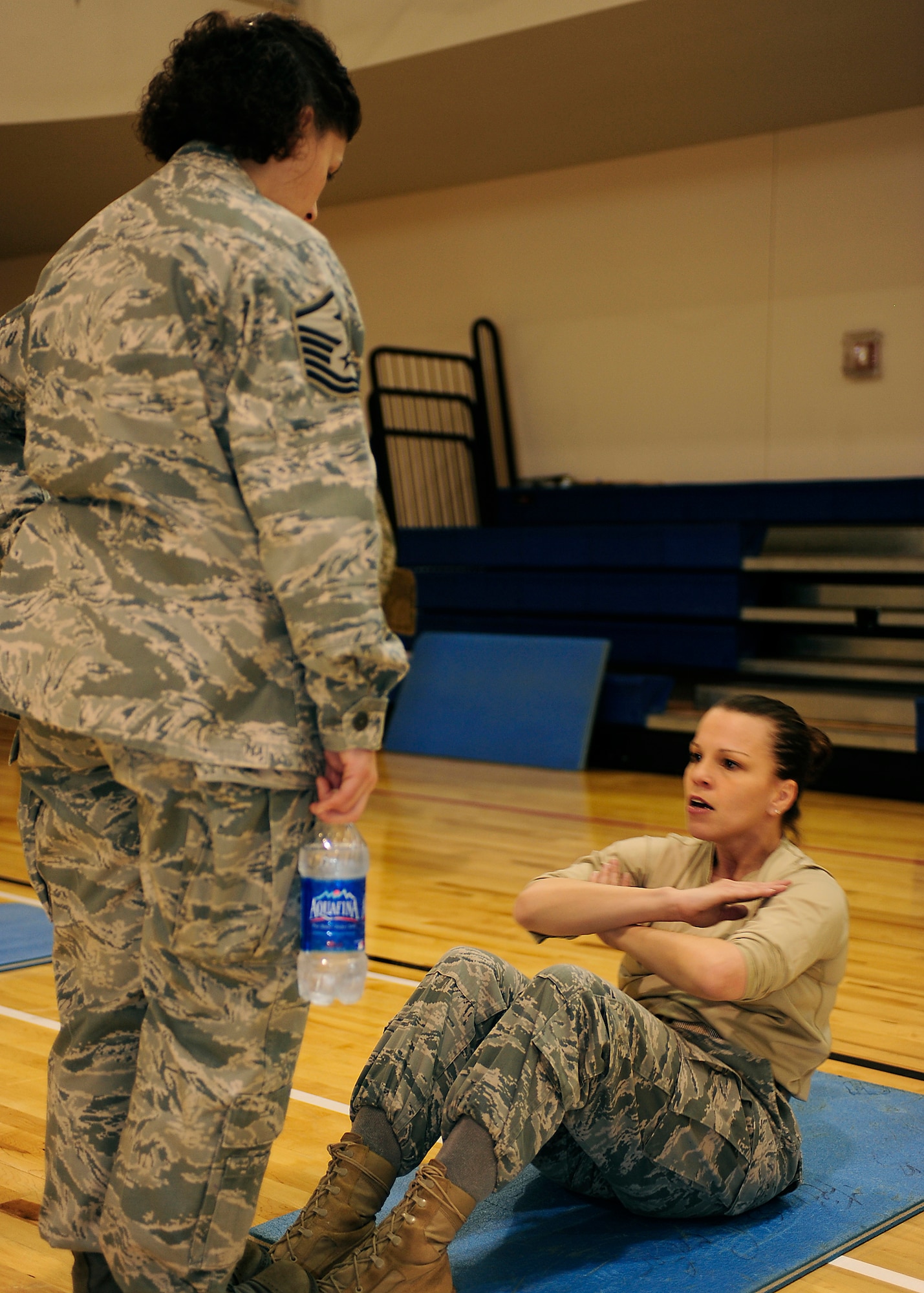 HOLLOMAN AIR FORCE BASE, N.M. -- Master Sgt. April Owen, 49th Force Support Squadron first sergeant, performs sit-ups as a participant during the Iron Airman competition held at the Domenici Fitness and Sports Center, Jan. 29. Sergeant Owen was a member of the first sergeant team and completed 237 sit-ups in ten minutes -- a record for the women's category. (U.S. Air Force photo by Senior Airman DeAndre Curtiss)