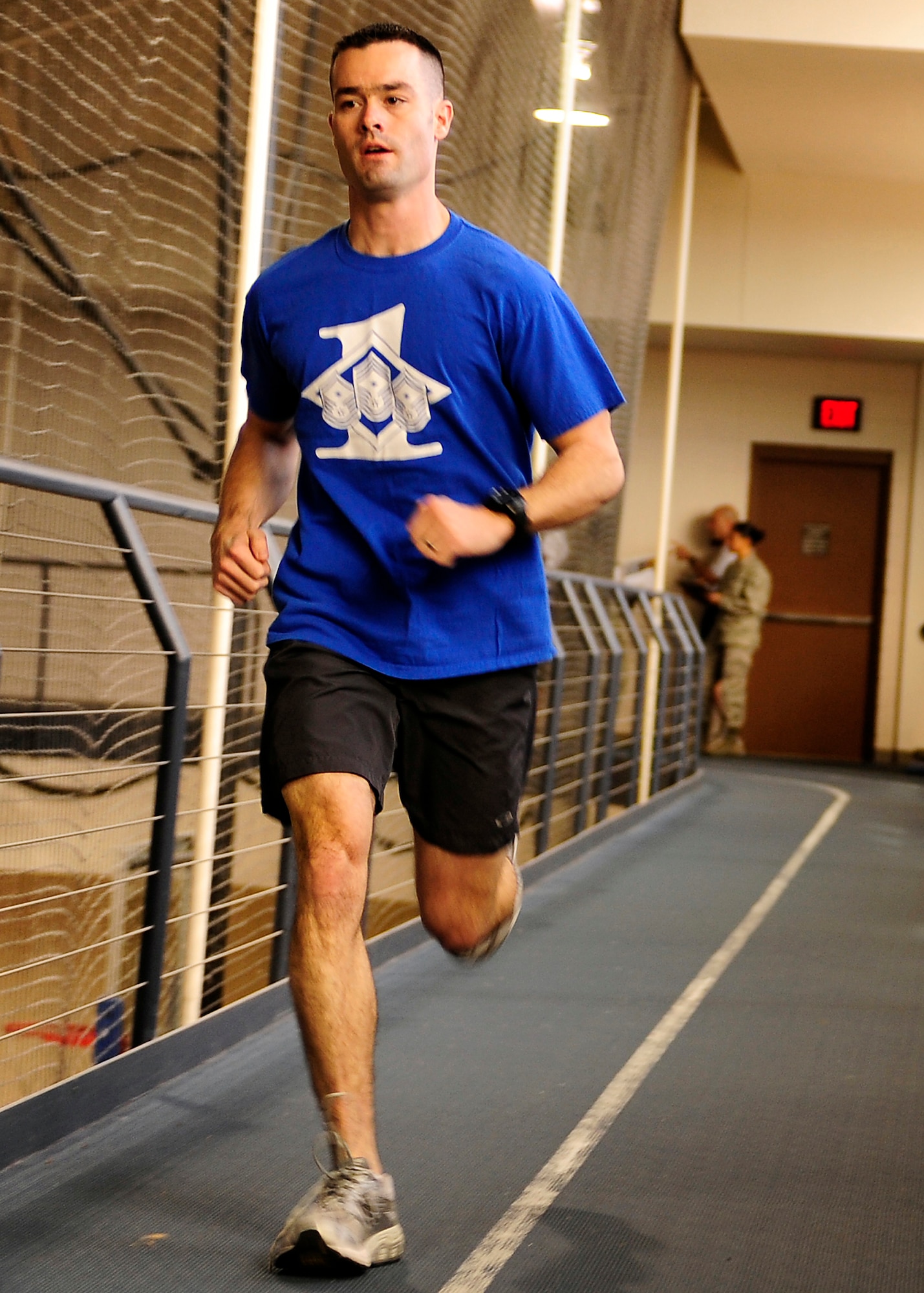 HOLLOMAN AIR FORCE BASE, N.M. -- Master Sgt. Dave Kalal, 49th Communications Squadron first sergeant, runs on the indoor track at the Domenici Fitness and Sports Center during the Iron Airman competition, Jan. 29. Sergeant Kalal was a member of the first sergeant team that won the competition. (U.S. Air Force photo by Senior Airman DeAndre Curtiss)
