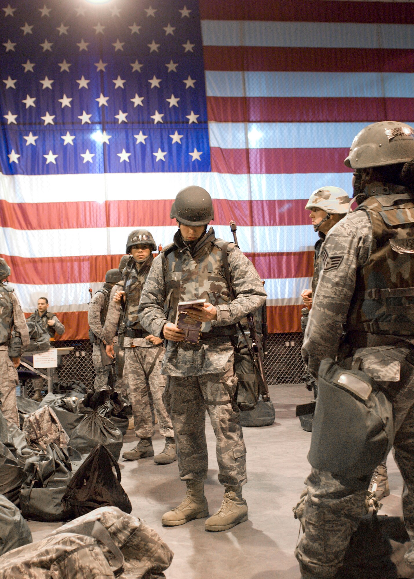 An Edwards Airman reads his AFMAN 10-100 during Phase II of an Operational Readiness Exercise Jan. 27 at the at the Mobility Processing Center. The exercise prepared Edwards Airmen for potential real world events and deployment. (Air Force photo/Mike Cassidy)
