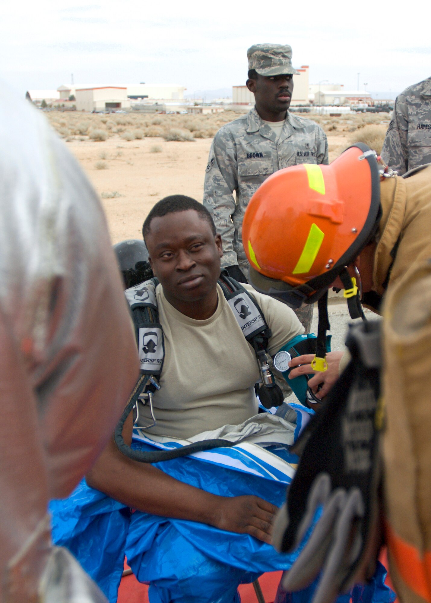 Staff Sgt. Alexander Adeleye, 95th Aerospace Medicine Squadron bioenvironmental engineer, receives medical attention during an Emergency Management Exercise Jan. 26 here. (Air Force photo/Heather Anhalt) 