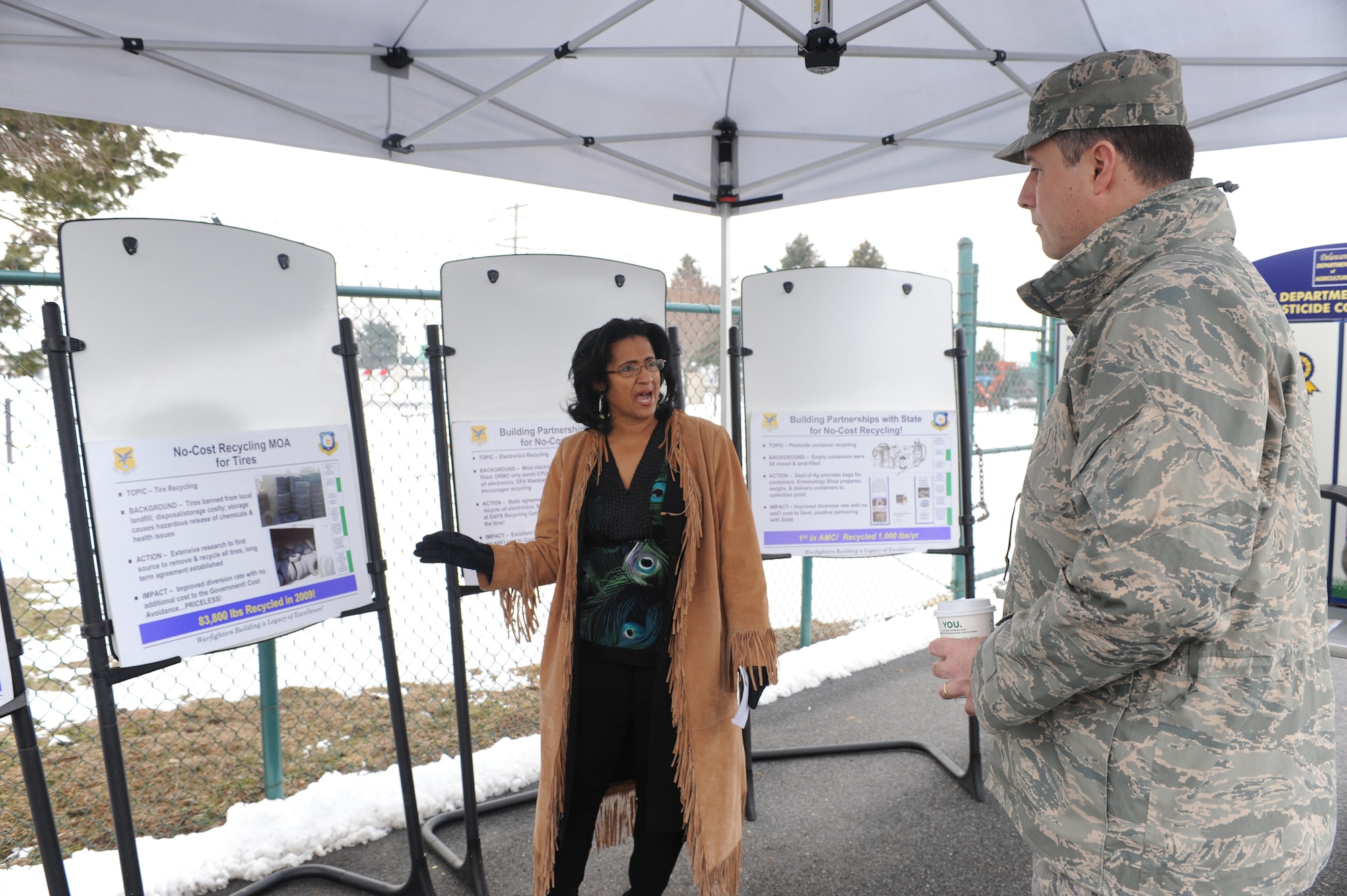 (Left) Valerie Payton, 436th Civil Engineering Squadron, briefs Col. John Bird, Installation Excellence Selection Board member, Feb. 2. Ms. Payton?s spoke about working with the state and other services to increase Dover?s recycling efforts at no additional cost to the government, resulting in a no-cost recycling program for certain hard-to-recycle items such as tires, electronic components and pesticide containers. (U.S. Air Force photo/Roland Balik)