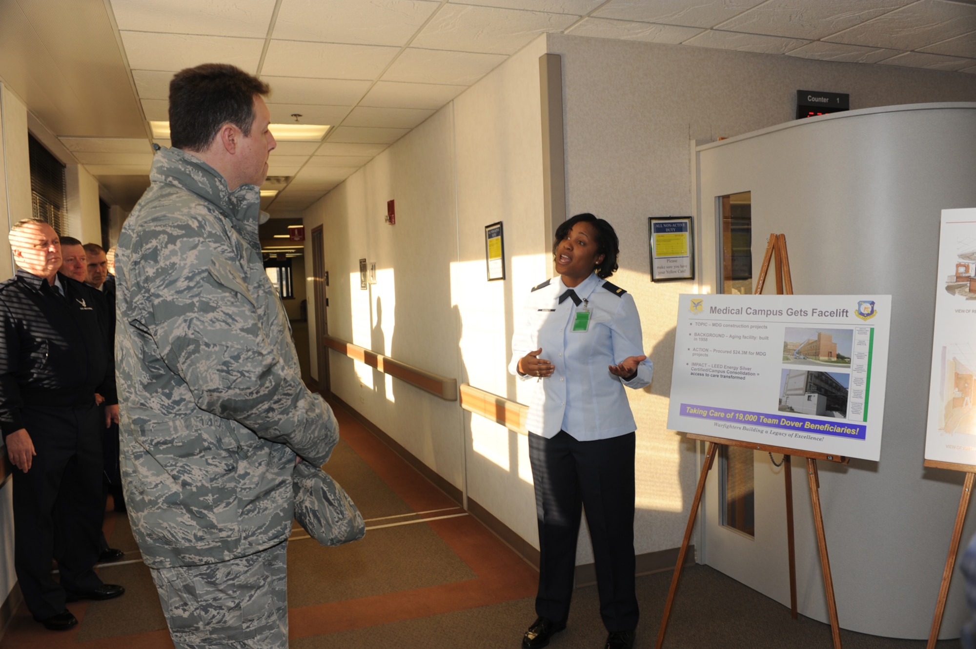 (Right) 2nd Lt. Danielle Garner, 436th Medical Support Squadron, briefs Col. John Bird, Installation Excellence Selection Board member, Feb. 1. Lieutenant Garner briefed on the recent renovations to the Medical Group building. These renovations consolidated the medical campus and increased the energy conservation of the medical group. (U.S. Air Force photo/Brianne Zimny)