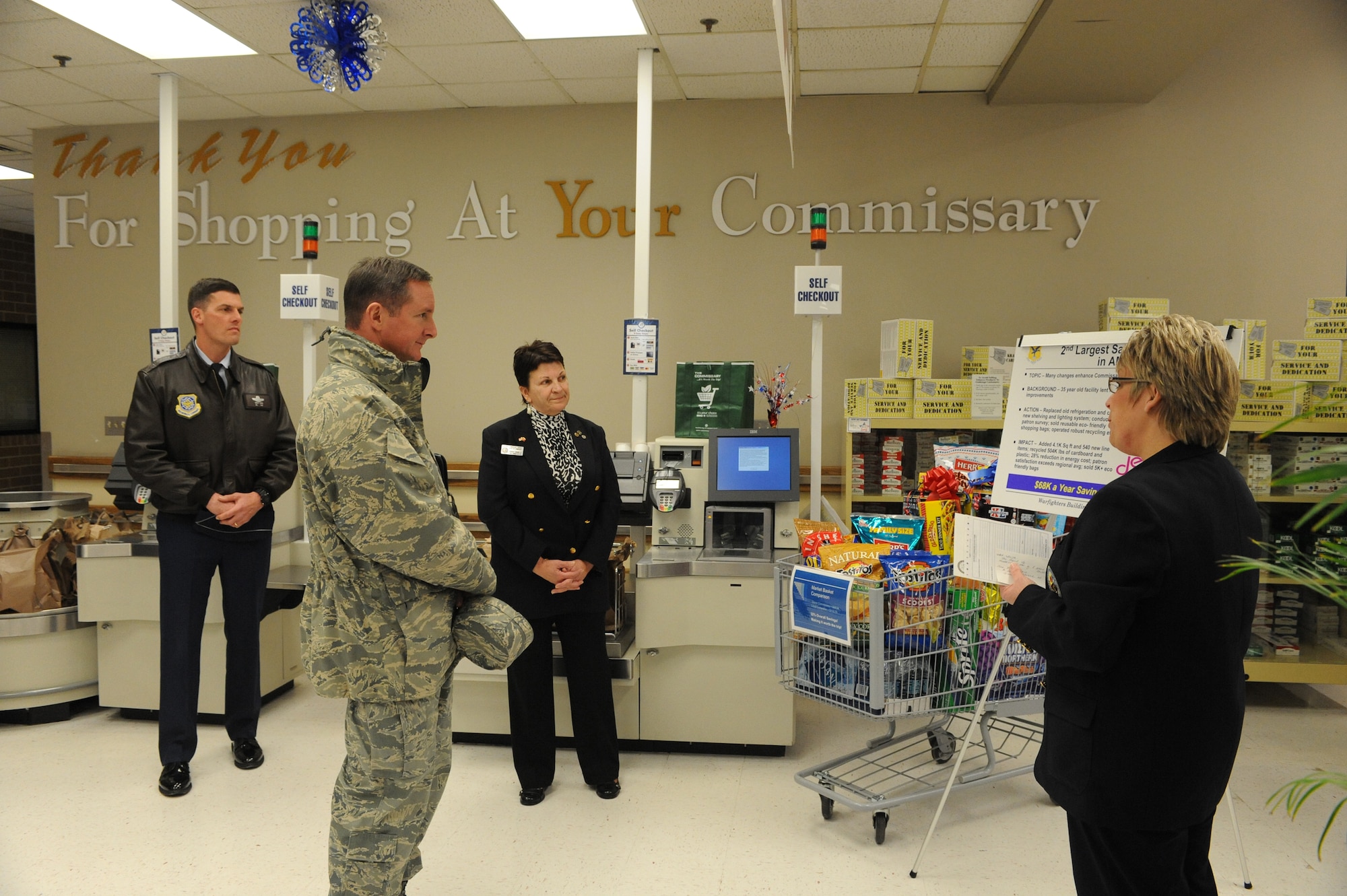 (Right) Lisa L. Serrano, Commissary director, briefs Col. Stephen Clark, Installation Excellence Selection Board member, Feb. 1. She spoke about the Commissary?s sales growth, as well as the replacement of the old refrigeration units with new ones that conserve energy. (U.S. Air Force photo/Roland Balik)