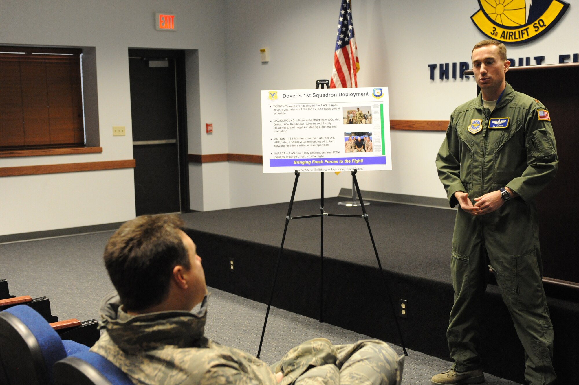 (Right) Maj. A.J. LaRose, 3rd Airlift Squadron, Col. John Bird,  Installation Excellence Selection Board member, Feb. 2. He briefed about the 3rd AS deployment to southwest Asia a year ahead of schedule, during which they delivered more than 146,000 passengers and more than 129 million pounds of cargo. (U.S. Air Force photo/Roland Balik)