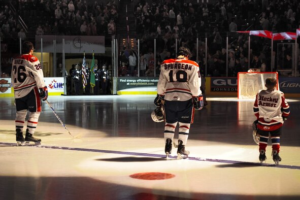 FAIRCHILD AIR FORCE BASE, Wash. - The Fairchild Honor Guard presents the colors during a Military Appreciation Ceremony as Spokane Chiefs team members lower their heads Jan. 30. (U.S. Air Force photo / Senior Airman Joshua Chapman)
