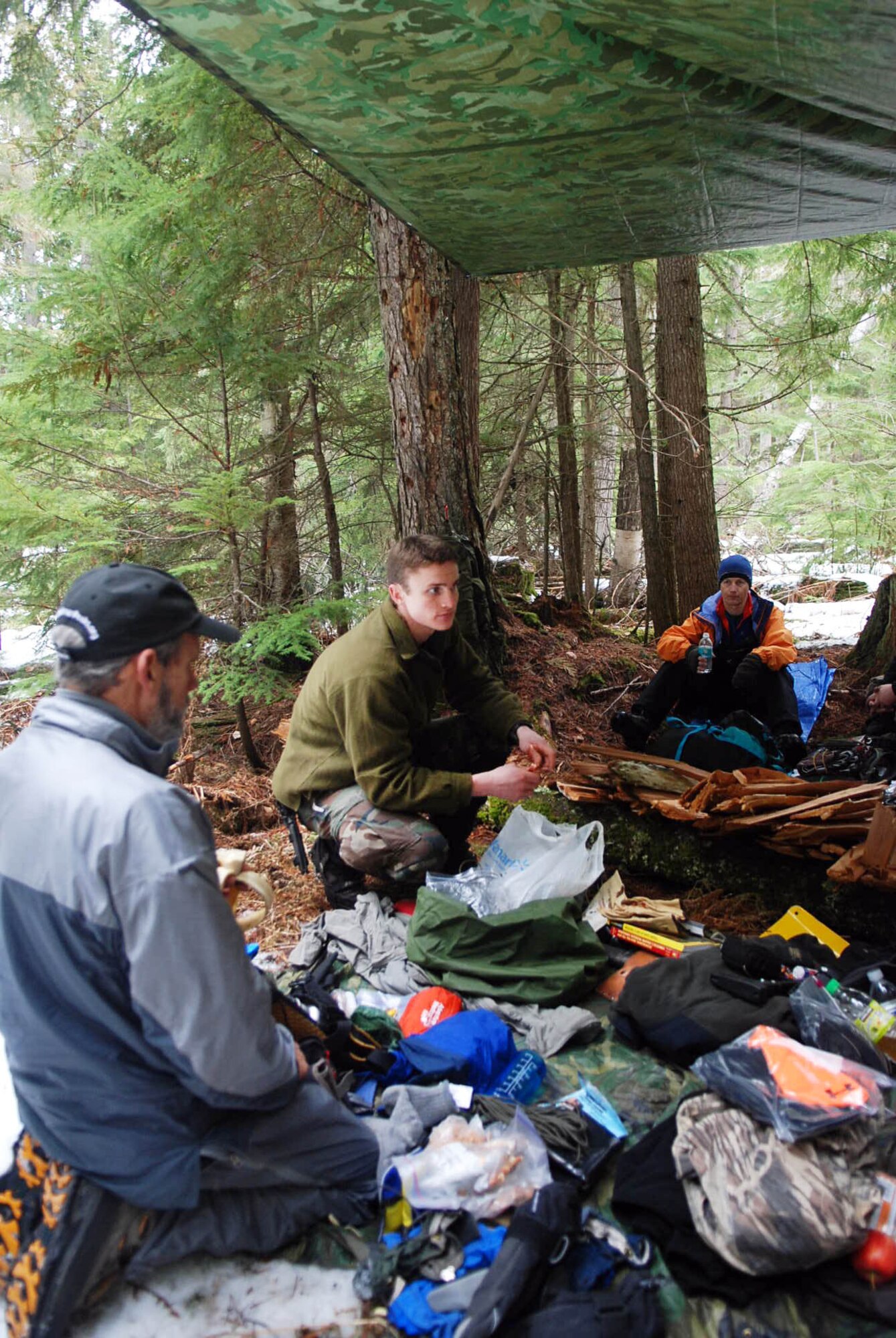 PRIEST LAKE, Idaho - Airman 1st Class Jason Allchin, SERE Specialist, talks to his group about important items to carry in a winter survival situation. (U.S. Air Force photo / Senior Airman Emerald Ralston)