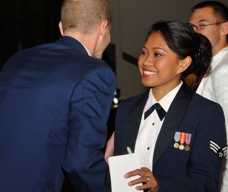 FAIRCHILD AIR FORCE BASE, Wash. - Airman Henderson greets audience members following a performace of Tops in Blue. (U.S. Air Force photo / Master Sgt. Mindy Gagne)