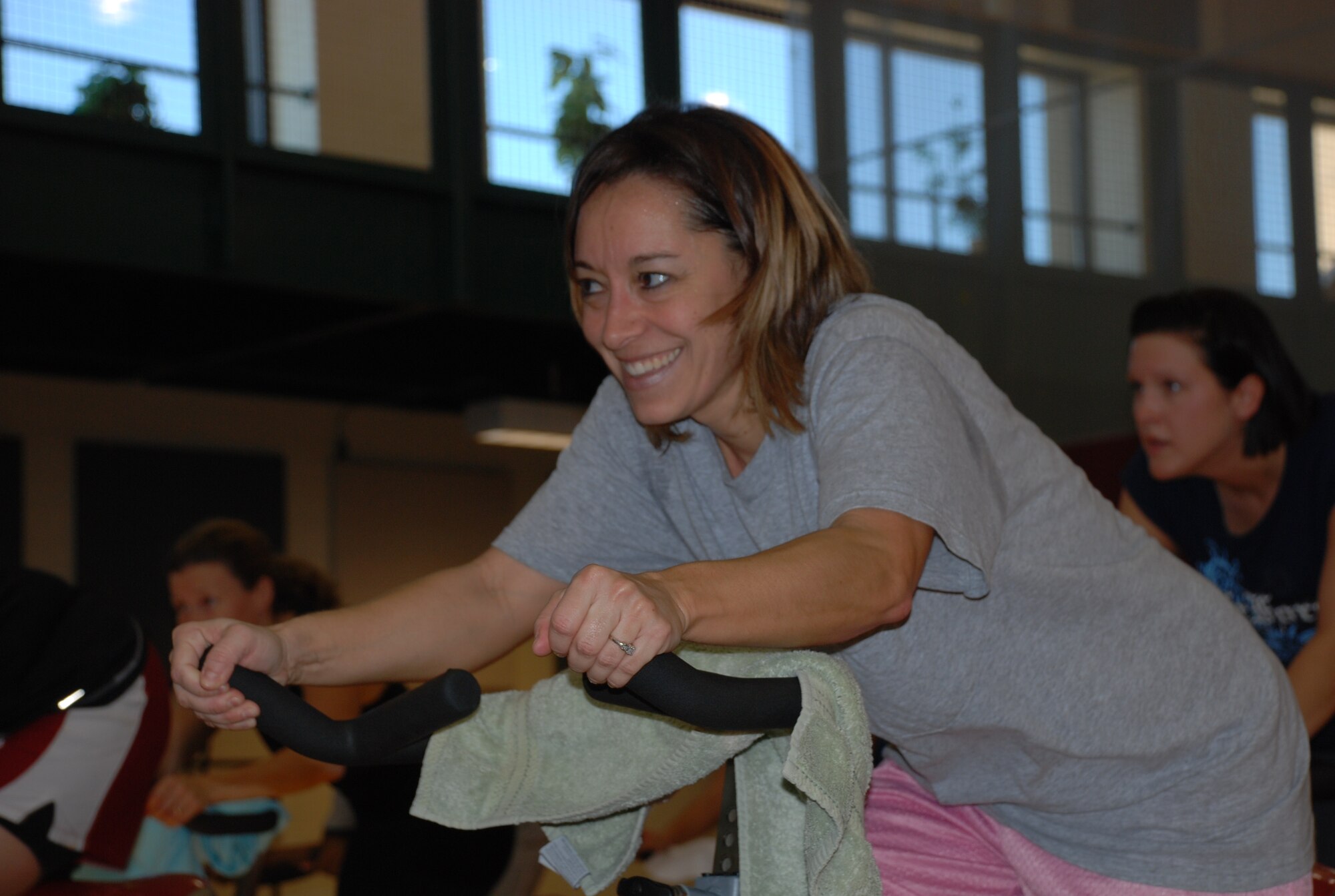 LAUGHLIN AIR FORCE BASE, Texas – Lashonda Holcombe, spouse of Capt. Beau Holcombe, 47th Operations Group, takes part in the spinning class at the Super Fit Jump Start event held at the Losano Fitness Center here Jan. 30. The first-ever event was designed to let participants try out six different types of exercise programs to see what fit them the best and then sign up for classes at the center. (U.S. Air Force photo by Tech. Sgt. Charlie Miller)
