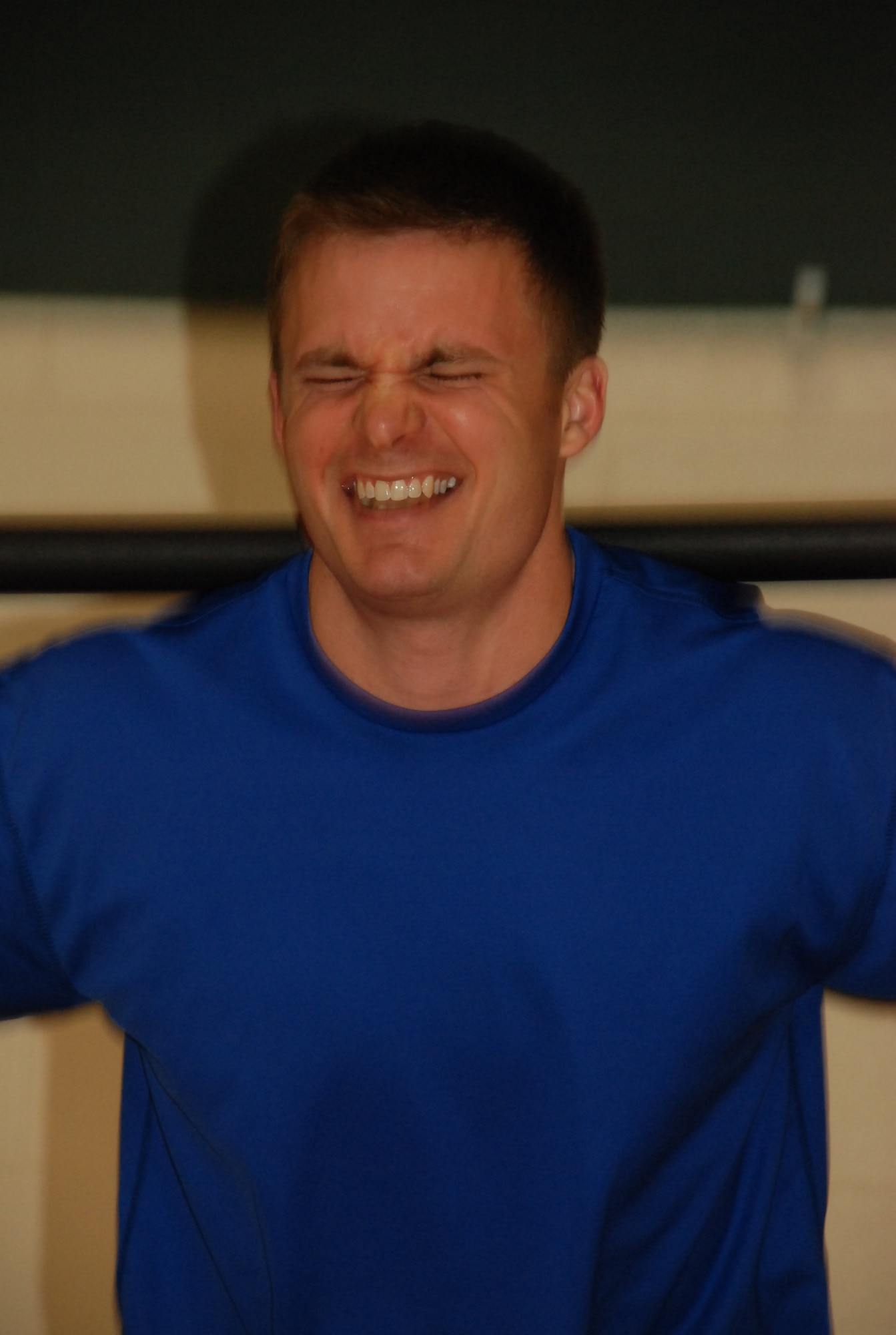 LAUGHLIN AIR FORCE BASE, Texas – First Lt. Skylar Rollins, 86th Flying Training Squadron instructor pilot, grimaces while taking part in the circuit training class at the Super Fit Jump Start event held at the Losano Fitness Center Jan. 30. Here, Lieutenant Rollins lifts a weight bar, one of the 12 different exercise stations participants rotated to during the circuit training class. Super Fit, a first-ever event, was designed to let participants try out six different types of exercise programs to see what fit them best and then sign up for classes. (U.S. Air Force photo by Tech. Sgt. Charlie Miller)