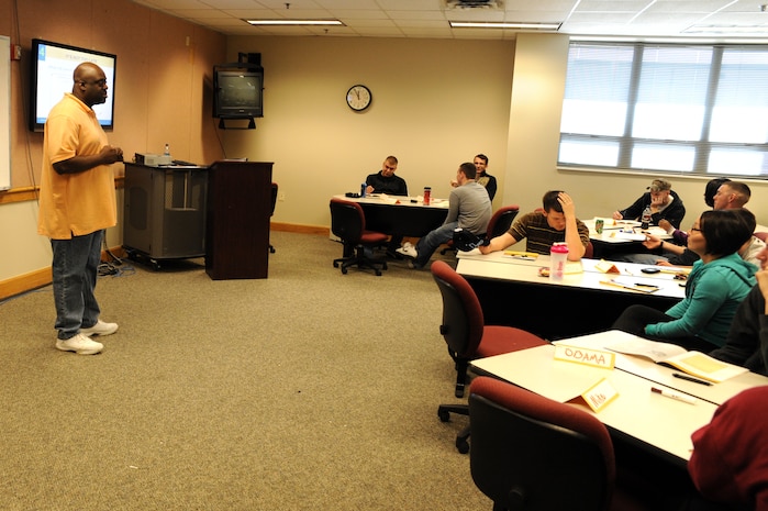 Staff Sgt. Jeffrey Graham instructs students during an Alive at 25 class at the education center here Feb. 3. Sergeant Graham teaches the class in civilian attire to help students relax in a less structured learning environment and be open about the issues they face. Sergeant Graham is a ground safety technician with the 628th Air Base Wing Safety Office. (U.S. Air Force photo/James M. Bowman)