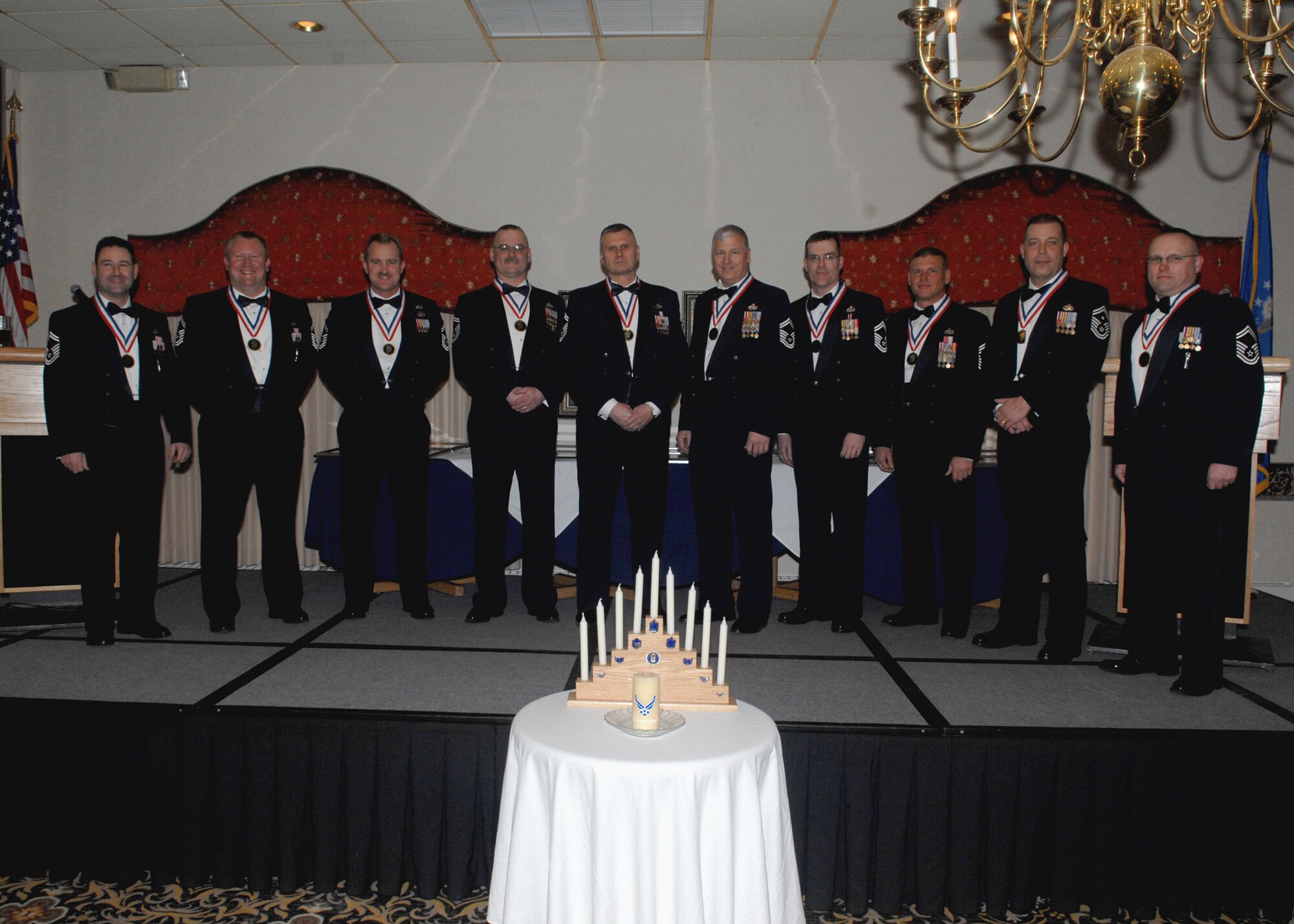 MINOT AIR FORCE BASE, N.D. -- Newly inducted members of the Minot Chiefs Group celebrate at the Jimmy Doolittle Center here Jan. 29. The rank of Chief Master Sgt. is the highest enlisted rank possible to be held by any Airman. By Federal law, only one percent of the Air Force enlisted force may hold the rank of Chief Master Sgt. (U.S. Air Force photo by Senior Airman Michael J. Veloz)