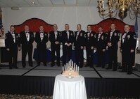 MINOT AIR FORCE BASE, N.D. -- Newly inducted members of the Minot Chiefs Group celebrate at the Jimmy Doolittle Center here Jan. 29. The rank of Chief Master Sgt. is the highest enlisted rank possible to be held by any Airman. By Federal law, only one percent of the Air Force enlisted force may hold the rank of Chief Master Sgt. (U.S. Air Force photo by Senior Airman Michael J. Veloz)