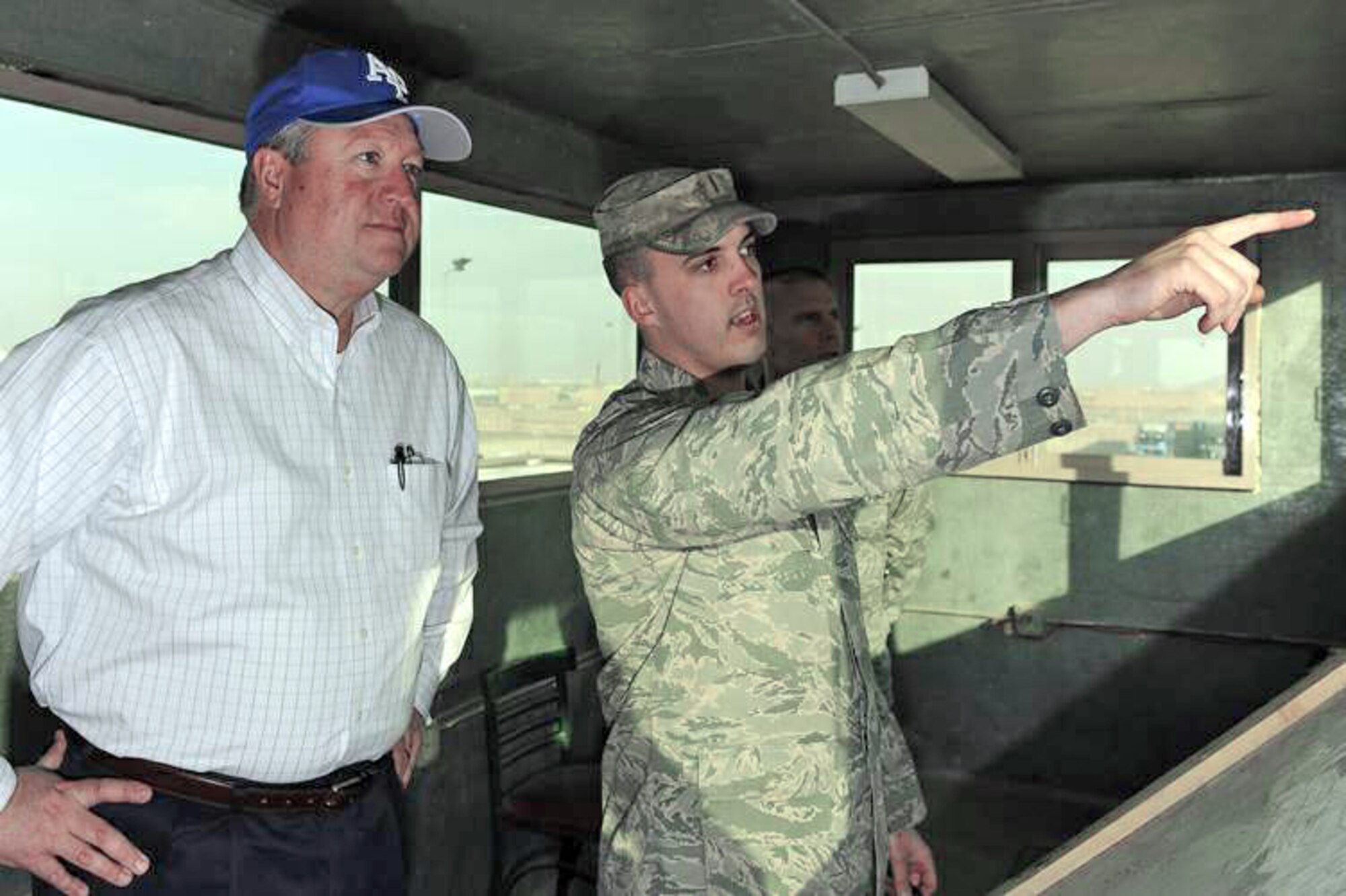 Secretary of the Air Force Michael Donley is briefed by 2nd Lt. Josh Frizzell on entry control point procedures Feb. 2, 2010, at Bagram Airfield, Afghanistan. Secretary Donley was in Afghanistan to monitor the training efforts of the Afghanistan National Army Air Corps and to meet with Airmen. Lieutenant Frizzell is assigned to the 455th Expeditionary Security Forces Squadron. (U.S. Air Force photo/Tech. Sgt. Jeromy K. Cross)
