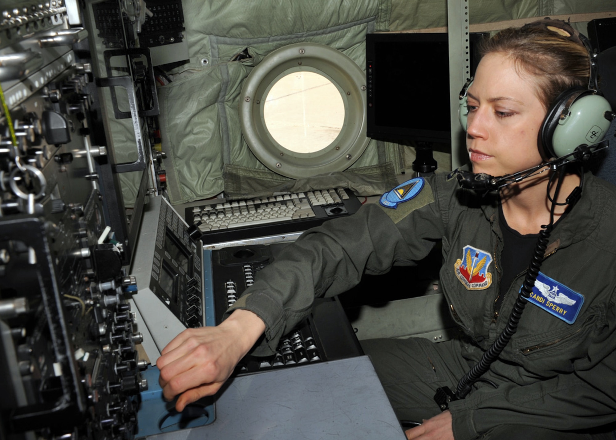 Capt. Candice Sperry performs an equipment check on an EC-130H Compass Call aircraft Feb. 1, 2010 at Davis-Monthan Air Force Base, Ariz. Captain Sperry was recently awarded the 2009 Air Force Robbie Risner Award for being the top weapons officer in the Air Force. Captain Sperry is a weapons officer in the 41st Electronic Combat Squadron. (U.S. Air Force photo/Staff Sgt. Valerie M. Smith)