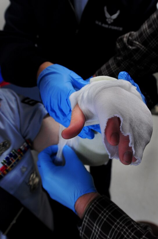 ELLSWORTH AIR FORCE BASE, S.D. -- Members of the 28th Medical Operations Squadron apply a temporary cast to the arm of Airman 1st Class Christopher Miller, 28th Security Forces Squadron, Feb. 1, 2010. The 28 MDOS treats a wide variety of medical issues ranging from sickness, injuries, and dental. (U.S. Air Force photo/Airman 1st Class Joshua J. Seybert)