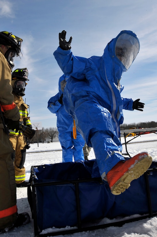 Senior Airman Jesse Ford, 779th Aerospace Medical Squadron bioenvironmental engineer, steps out of a decontamination tub during a hazardous material exercise at Joint Base Andrews, Md., Feb. 1, 2010. The exercise helped Airmen stay proficient in HAZMAT and decontamination procedures. (U.S. Air Force photo by Airman 1st Class Perry Aston) 