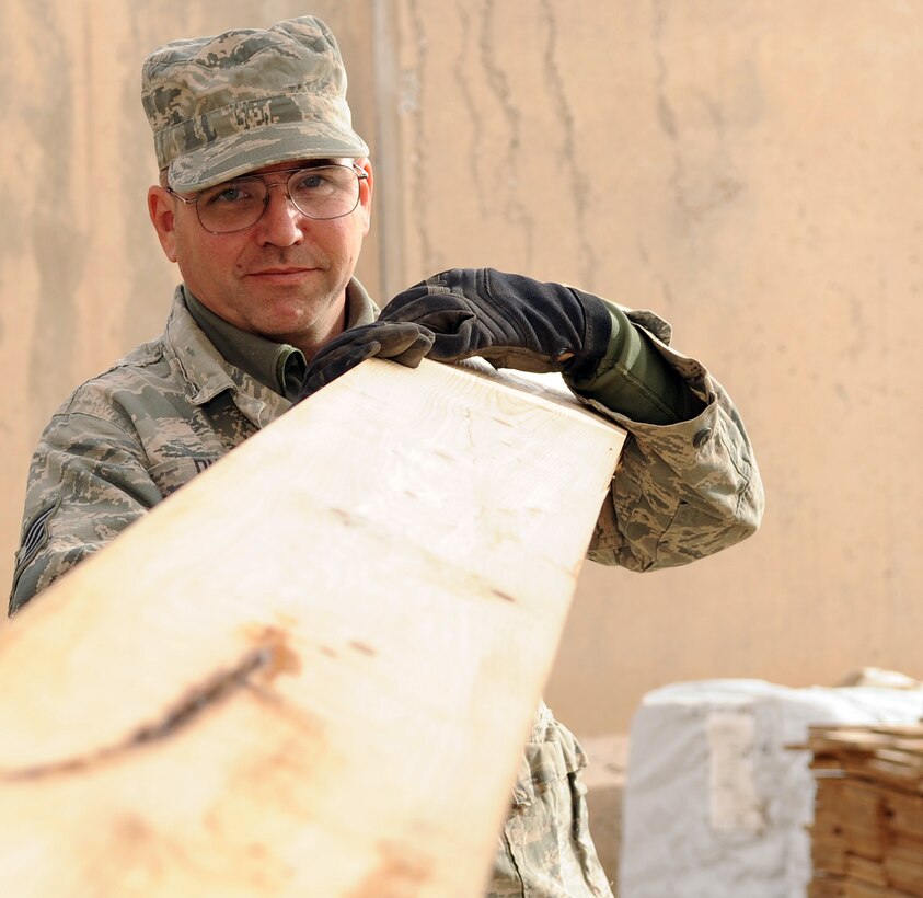 Tech. Sgt. Mark Duran builds support beams Jan. 28, 2010 at Kirkuk Air Base, Iraq. Sergeant Duran is now six years cancer free. He is a 506th Expeditionary Civil Engineer Squadron structures technician deployed from 301st Civil Engineer Squadron Joint Reserve Field Carswell Fort Worth, Texas. (U.S. Air Force photo/Staff Sgt. Tabitha Kuykendall)