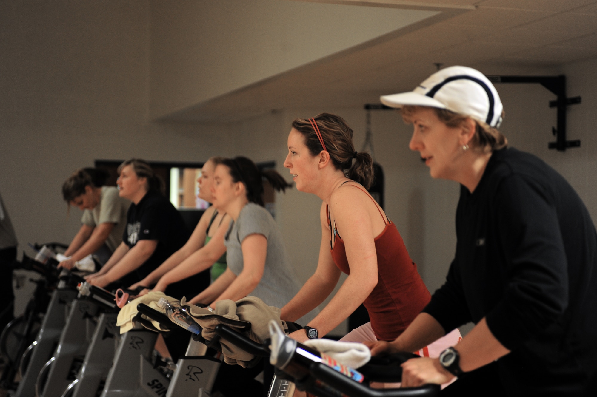 Wives of deployed Airmen endure a spin class at the Bellamy Fitness Center Feb. 2, 2010, at Ellsworth Air Force Base, S.D. The Freedom Miles program was developed by Lori Waddell of the 28th Force Support Squadron as a means to stay active and meet other spouses of deployed Airmen. (U.S. Air Force photo/Airman 1st Class Anthony Sanchelli)