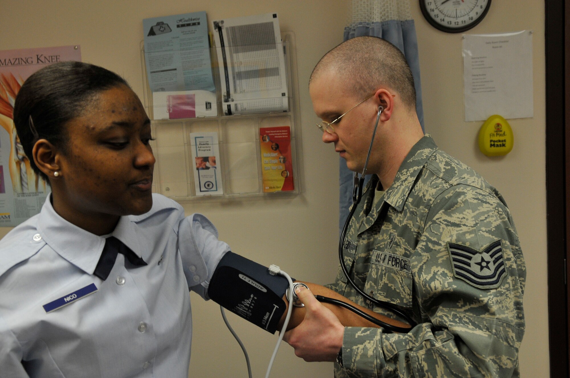 Tech. Sgt. John G. Howard takes Airman Richelle Nico's blood pressure during a demonstration Jan. 1, 2010, Eielson Air Force Base. The aerospace medicine flight treats pilots, emergency responders, their families and other select groups. Sergeant Howard and Airman Nico are assigned to the 354th Medical Group aerospace medicine flight. (U.S. Air Force photo/Airman 1st Class Janine Thibault)