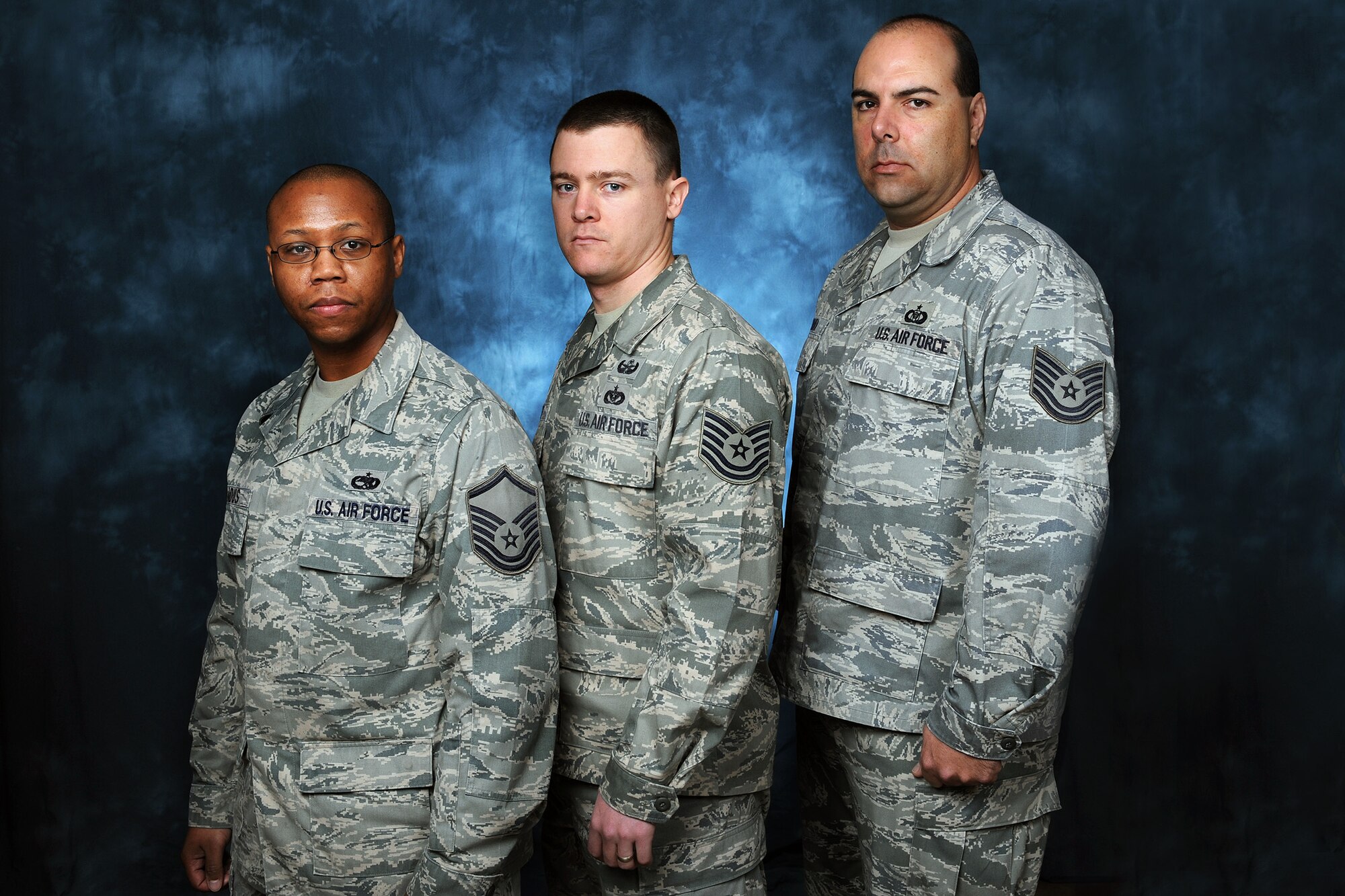 Master Sgt. Jason Broadus, left, Tech. Sgt. Brian Worley and Tech. Sgt. Humberto Camara, right, received promotions recently through the Stripes for Exceptional Performers program. The STEP program is a promotion recognition program used by commanders to recognize outstanding contributions and accomplishments. Sergeant Broadus, aerospace ground equipment craftsman with the 437th Maintenance Squadron, received his promotion Christmas Eve; Sergeant Worley, explosives ordnance disposal craftsman with the 628th Civil Engineer Squadron, was promoted Dec. 23; and Sergeant Camara, aviation resource manager with the 437th Operations Support Squadron, was promoted Jan. 6. The Airmen were officially promoted by Col. John Wood, 437th Airlift Wing commander, who was joined by Chief Master Sgt. Mike Ivey, 628th Air Base Wing command chief, and top leaders from each Airman's squadron and group. (U.S. Air Force photo/James M. Bowman)