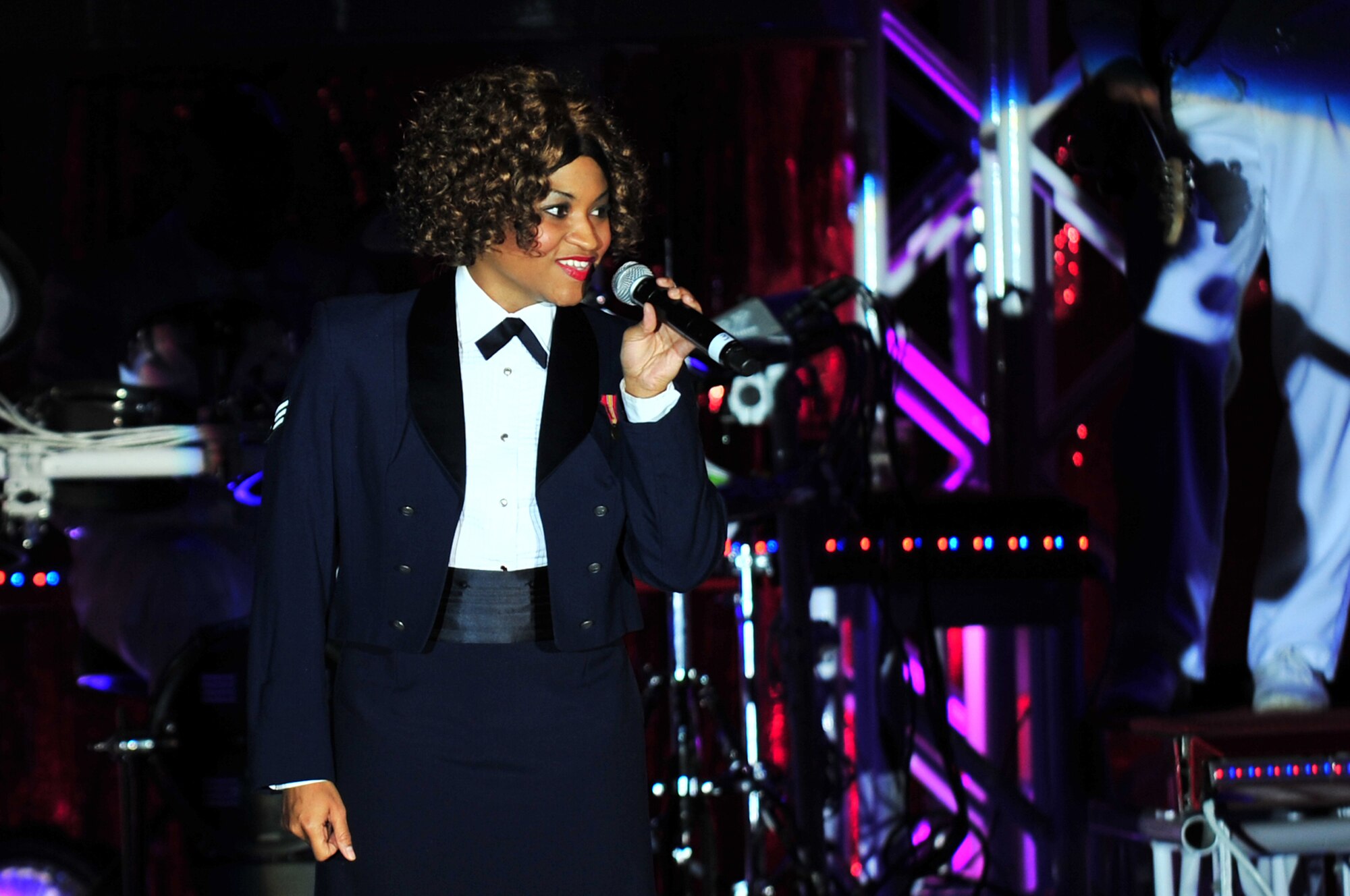 Senior Airman Tarryn Holyfield, Tops in Blue vocalist, addresses the audience during a performance at the Paramount Theater in downtown Goldsboro, N.C., Feb. 1, 2010. Holyfield's primary job is a bioenvironmental engineer apprentice with the 42nd Medical Group at Maxwell Air Force Base, Ala. She hails from Columbus, Ga. (U.S. Air Force photo/Senior Airman Rae Perry) 