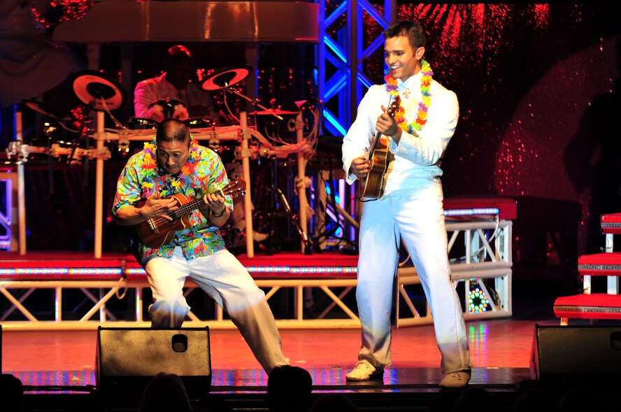 Master Sgt. Herbert Ancog and Senior Airman Shane Jones play ukuleles during a Tops in Blue performance at the Paramount Theater in downtown Goldsboro, N.C., Feb. 1, 2010. Tops in Blue Airmen travel across the world entertaining military members, retirees and their families. Ancog hails from Waialua, Hawaii, and Jones is from Redondo Beach, Calif. (U.S. Air Force photo/Senior Airman Rae Perry)
