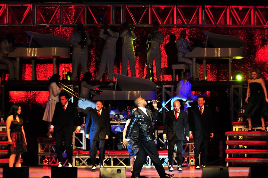 Members of the Air Force expeditionary entertainers, Tops in Blue, perform for an audience at the Paramount Theater in downtown Goldsboro, N.C., Feb. 1, 2010. The entertainment team has 16 vocalists, 10 musicians and nine technical crew who perform more than 120 shows worldwide each year.  (U.S. Air Force photo/Senior Airman Rae Perry)