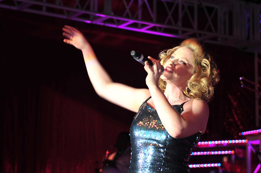 Senior Airman Jennifer Frost, Tops in Blue vocalist, performs for a packed Paramount Theater in downtown Goldsboro, N.C., Feb. 1, 2010. Frost joined the Tops in Blue group from Robins Air Force Base, Ga., where she was a services journeyman. She hails from Kalamazoo, Mich. (U.S. Air Force photo/Senior Airman Rae Perry) 