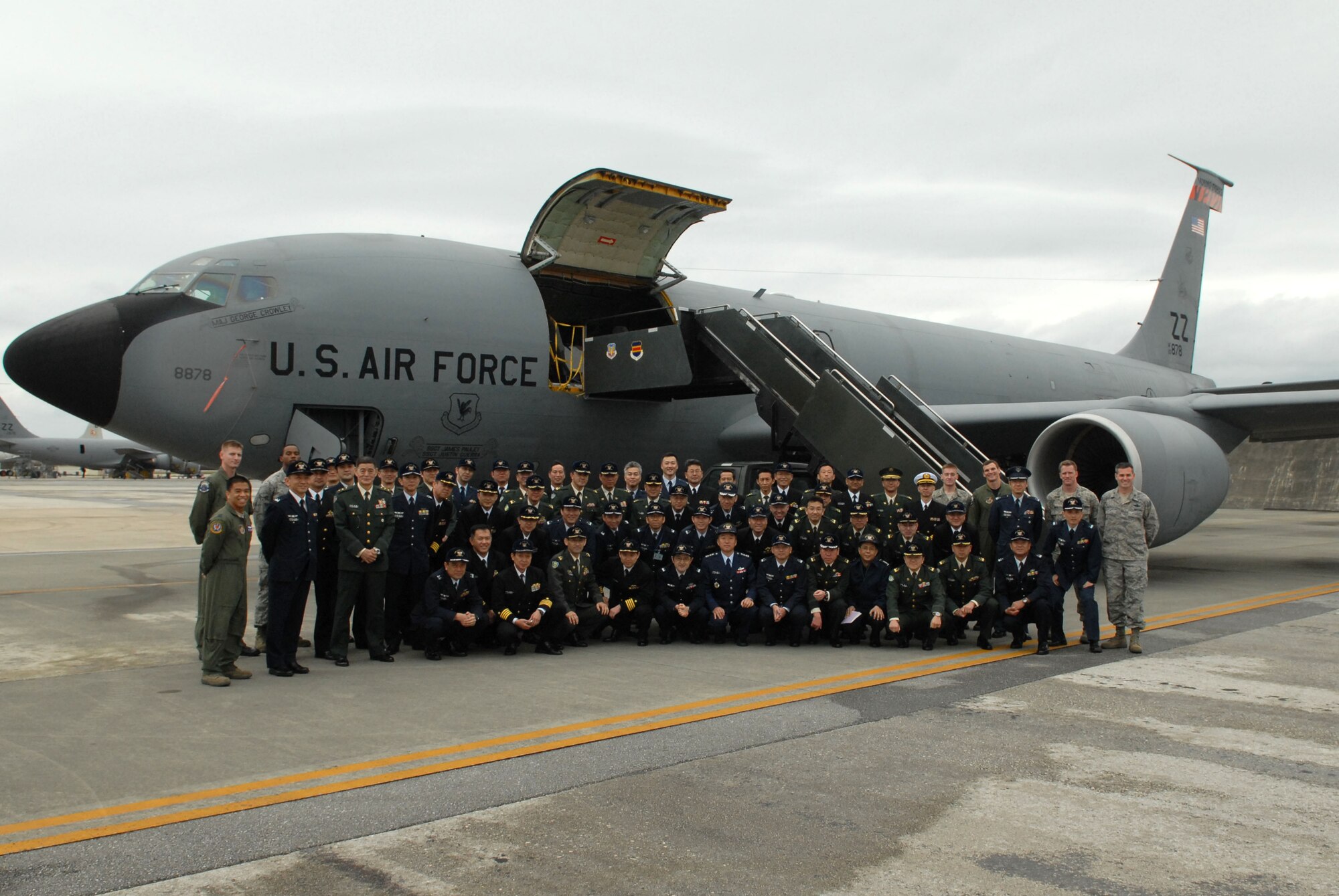 Students and instructors from the Japan Self Defense Force Joint Staff College pose with several Team Kadena members for a group photograph in front of a 909th Aerial Refueling Squadron KC-135 Stratotanker at Kadena Air Base, Feb. 3. Approximately 60 senior officers, to include Lt. Gen. Takashi Watanabe, the commandant of the college, made the trip from Tokyo to Kadena as part of JSDF's year-long advanced professional military education program.
(U.S. Air Force photo / Staff Sgt. Christopher Hummel)
