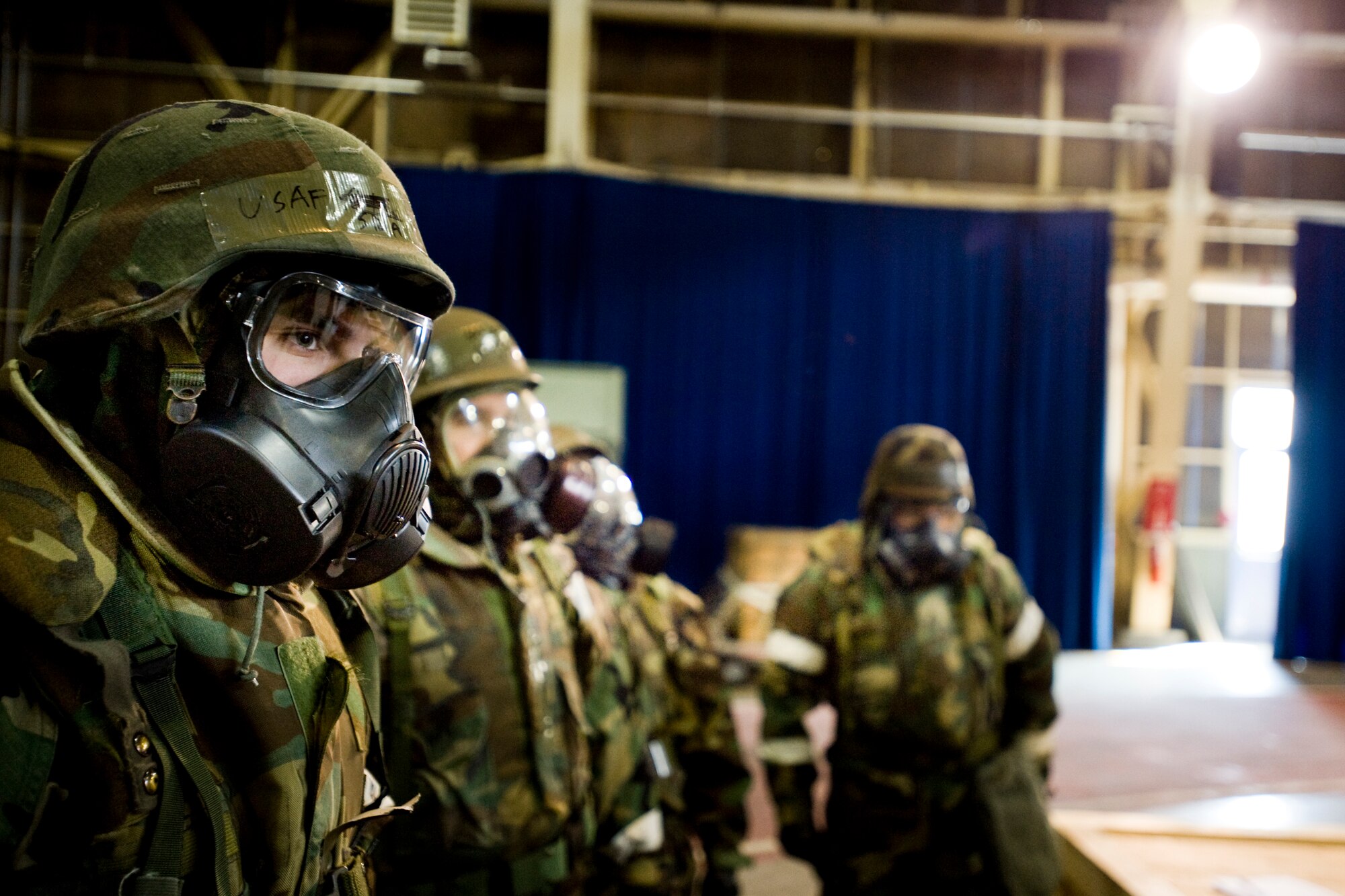MISAWA AIR BASE, Japan -- Airmen receive instructions at a simulated contamination control area Feb. 3 during an operational readiness exercise. Members of the contamination control team and participants trained as they went through the steps necessary to decontaminate Airmen.  (U.S. Air Force photo/Senior Airman Jamal D. Sutter)