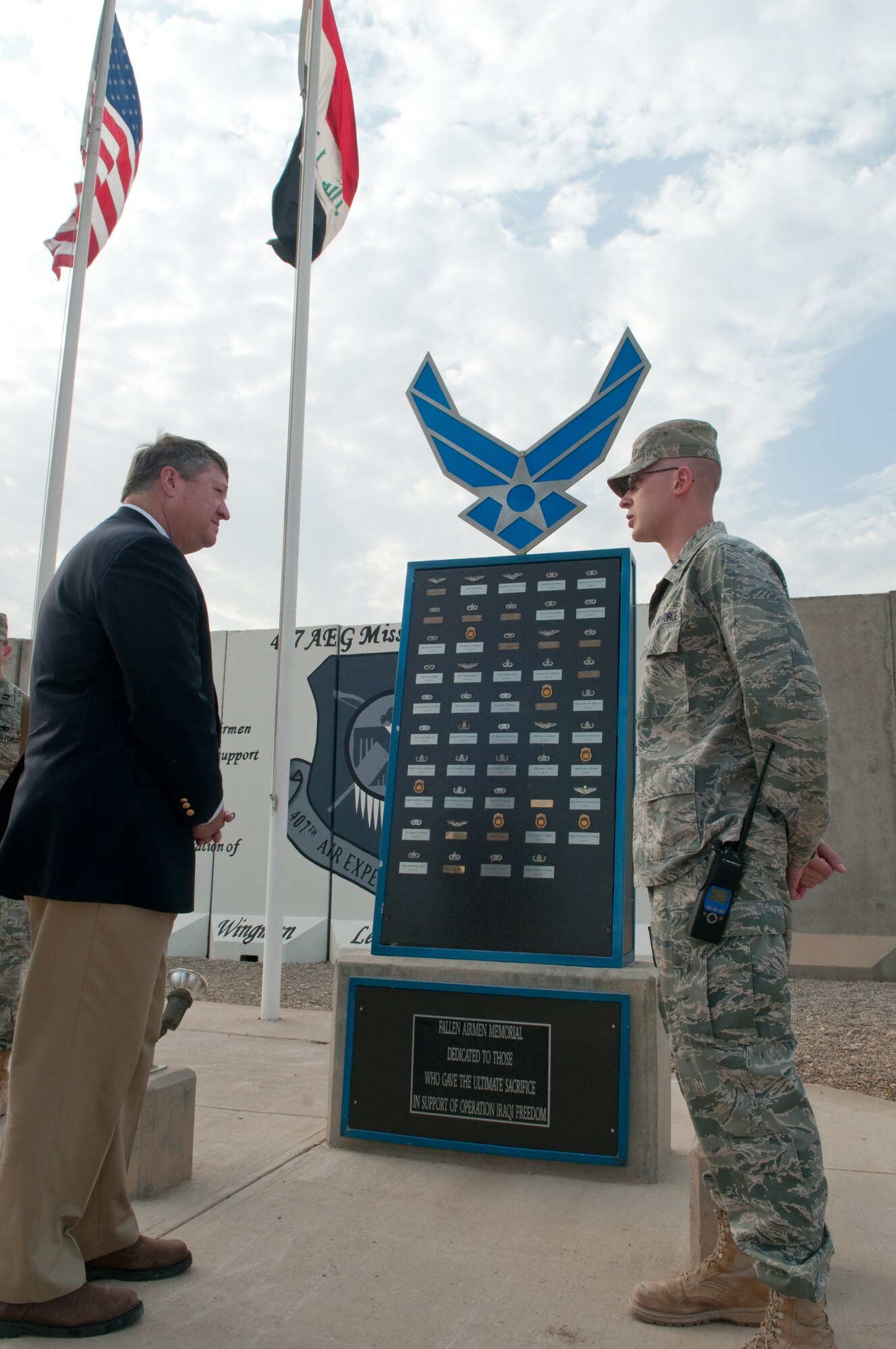 U.S. Air Force Capt. Nicholas D. Kuc, 407th Expeditionary Communications
Squadron from 31st Combat Comm. Squadron, Tinker AFB, Okla., explains the
purpose of the memorial to Secretary of the Air Force Michael Donley during
his visit to Ali Base, Iraq Jan. 31, 2010. The memorial is dedicated to
fallen Airmen who gave the ultimate sacrifice in support of Operation Iraqi
Freedom. (U.S. Air Force photo/Senior Master Sgt. Elizabeth Gilbert) Released