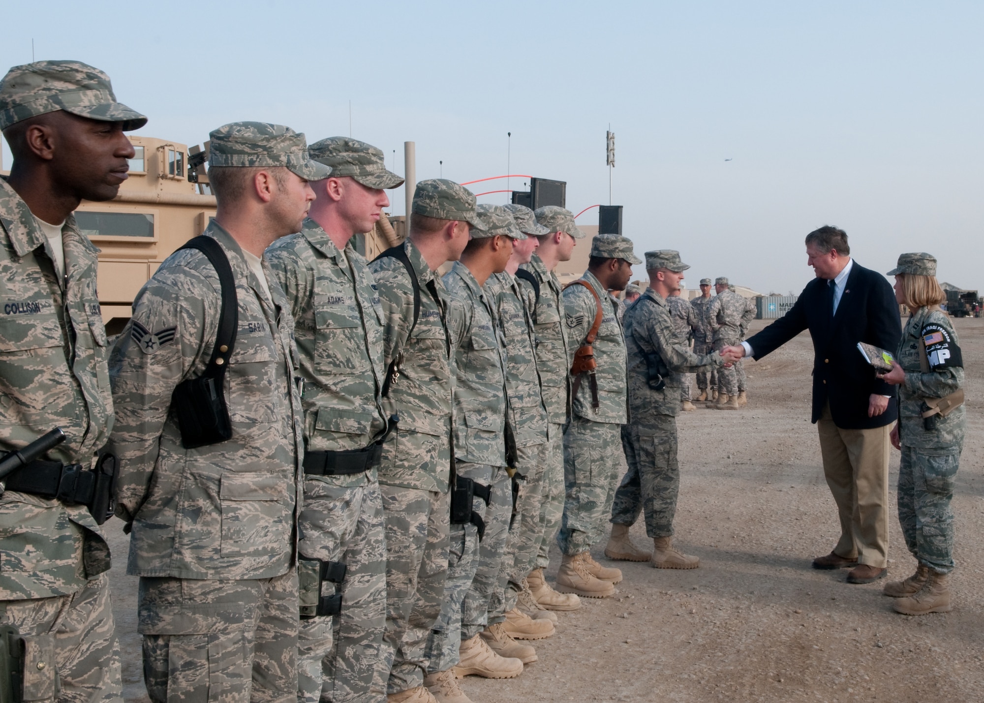 U.S. Air Force Capt. Jutta Arkan, commander, Provost Marshall's Office
(PMO), introduces her team of Joint Expeditionary Tasking (JET) Airmen
assigned to the U.S. Army, 4th Brigade Combat Team, 1st Armored Division, Special Troops Battalion, to Secretary of the Air Force Michael Donley during his visit to
Ali Base, Iraq, Jan. 31, 2010. These JET Airmen are performing law and order
missions as military police for the Army. (U.S. Air Force photo /Senior
Master Sgt. Elizabeth Gilbert) Released