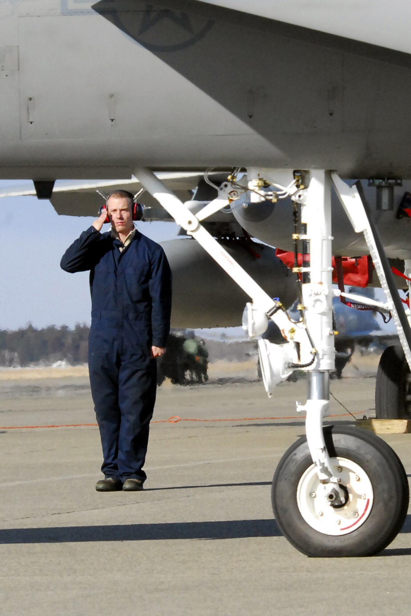 Staff Sgt. Joseph Snow, 67th Aircraft Maintenance Unit, salutes Capt. Cody Clark for the afternoon set of flights Feb. 3 at Hyakuri Air Base, Japan. 90 Airmen and six F-15s are operating from the base as part of an Aviation Training Relocation. (U.S. Air Force photo / 1st Lt. Bryan Bouchard)