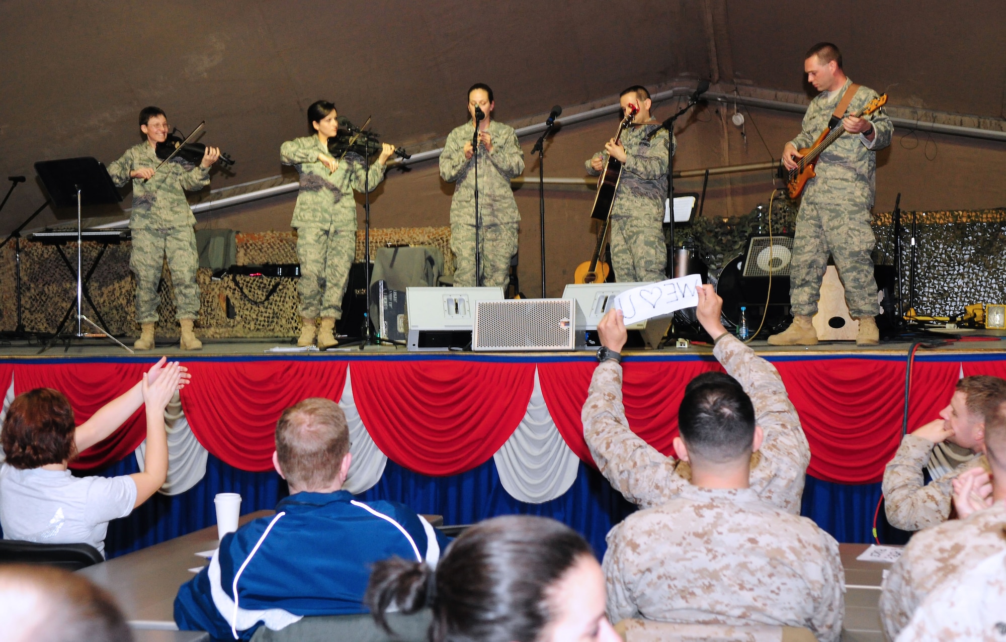U.S. Air Forces Central Public Affairs band "Celtic Aire" performs for Airmen, Soldiers, Sailors and Marines at the Transit Center at Manas, Kyrgyzstan, Jan. 31, 2010. (U.S. Air Force photo/Senior Airman Nichelle Anderson/Released)
