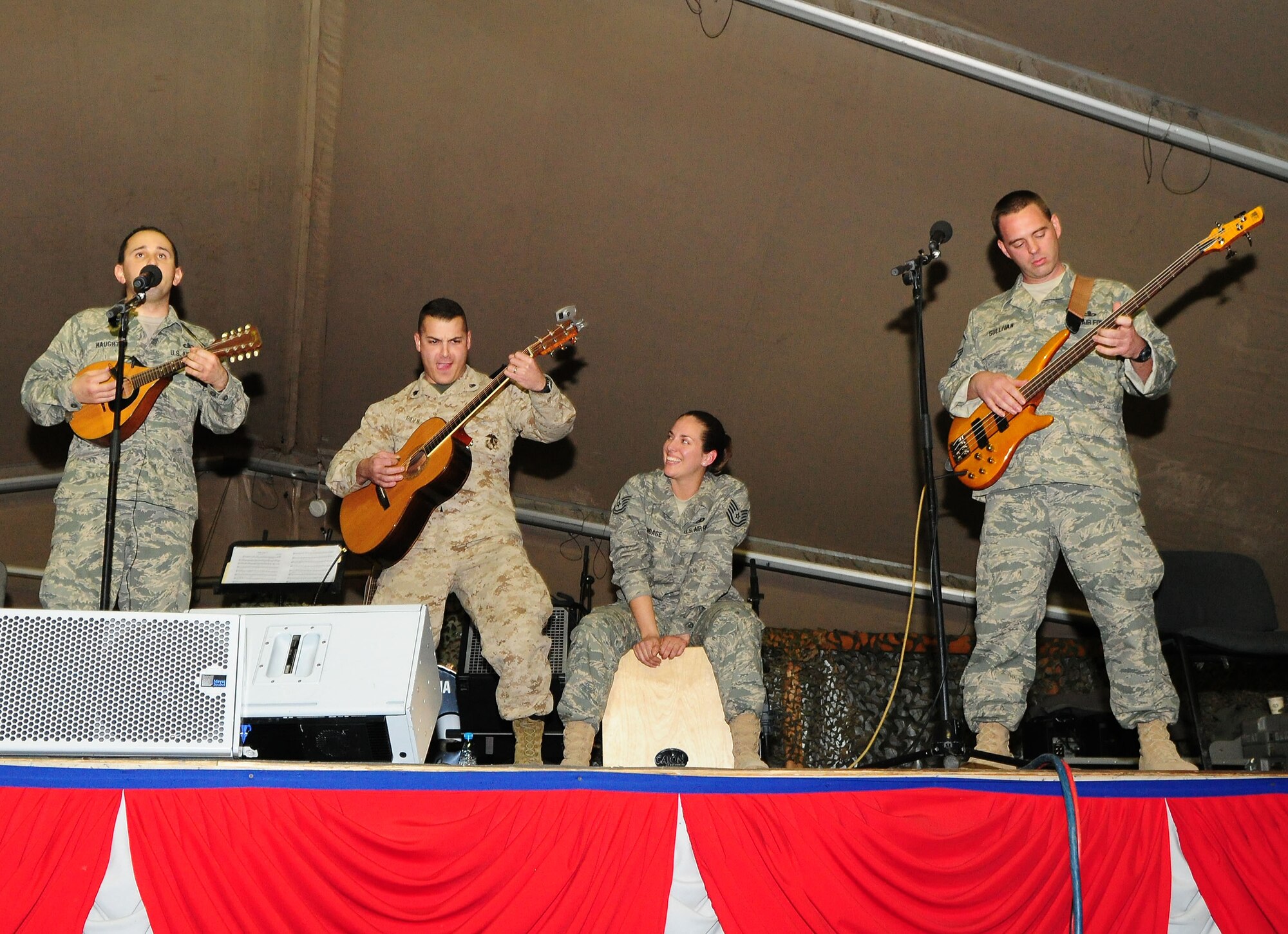 U.S. Marine Corps Sgt. Greg Riden joins the U.S. Air Forces Central Public Affairs band "Celtic Aire" during a performance at the Transit Center at Manas, Kyrgyzstan, Jan. 31, 2010. Sgt. Riden is transiting through with fellow Marines from the Heavy Marine Helicopter Squadron 462, Marine Corps Air Station Mirmar, San Diego. (U.S. Air Force photo/Senior Airman Nichelle Anderson/Released)

