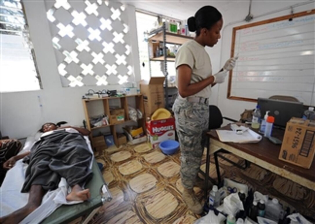 U.S. Air Force Lt. Jena Campbell, attached to Medical Element Joint Task Force Bravo, provides medical care to an earthquake survivor at a clinic in Killick, Haiti, on Jan. 30, 2010.  Joint Task Force Bravo is supporting Operation Unified Response by providing military support to civil authorities to help stabilize and improve the situation in the island nation.  