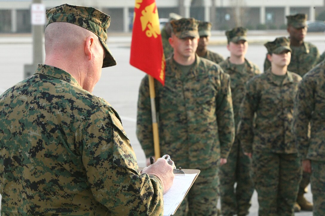 Sgt. Major Micheal Wootten scores the drill movements of Company I during the Headquarters and Support Battalion drill competition Feb. 4 in the base Marine Corps Exchange parking lot.