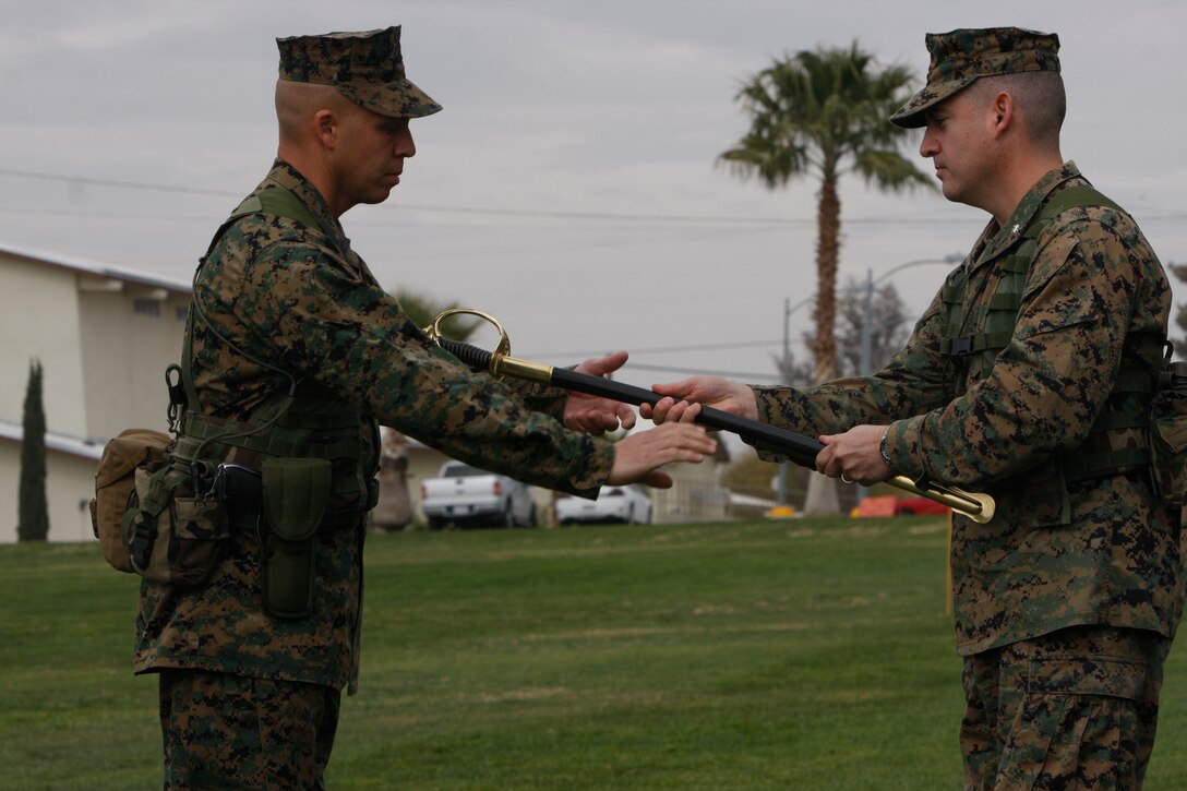 Sgt. Maj. Maximino Torres III, accepts the sword of office as sergeant major of 3rd Battalion, 11th Marine Regiment Feb. 5 from Lt. Col. Eduardo Abisellan, the commanding officer of the battalion. Torres assumed his post during a post and relief ceremony at the Combat Center’s Lance Cpl. Torrey L. Gray Field.