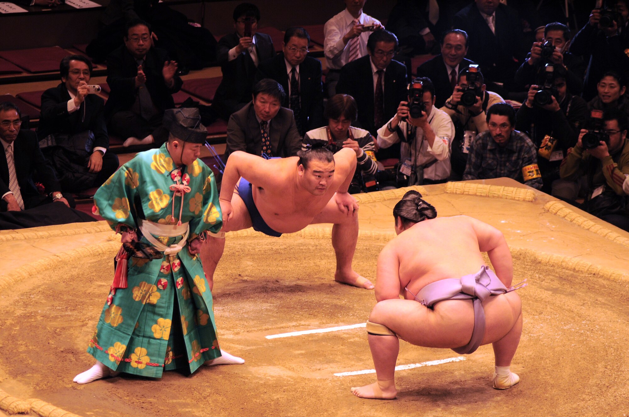 TOKYO -- Ushiomaru Motoyasu (front) faces of in his final sumo match at the Ryogoku Kokugikan Jan. 31. Amzumazwki-beya, a local Japanese sumo-training center, invited more than 600 students, parents and teachers from Yokota Air Base to experience this Japanese tradition. (U.S. Air Force photo/Airman 1st Class Katrina)