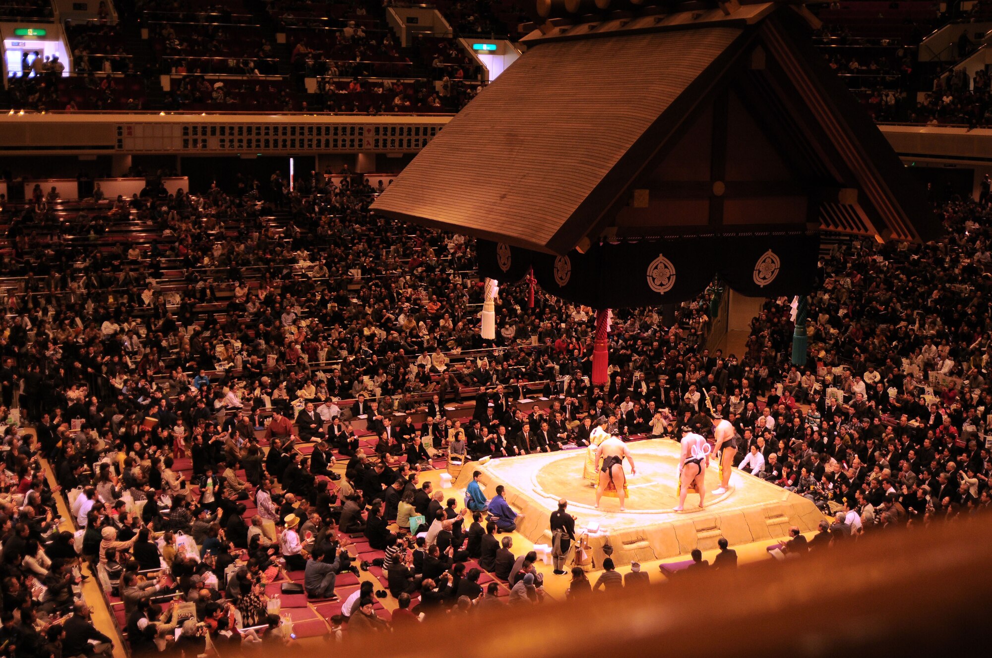 TOKYO --The champions or yokozuna begins the traditional cleansing of the dohyo or ring at the Ryogoku Kokugikan "arena" Jan. 31. Amzumazwki-beya, a local Japanese sumo-training center, invited more than 600 students, parents and teachers from Yokota Air Base to experience this Japanese tradition. (U.S. Air Force photo/Airman 1st Class Katrina)