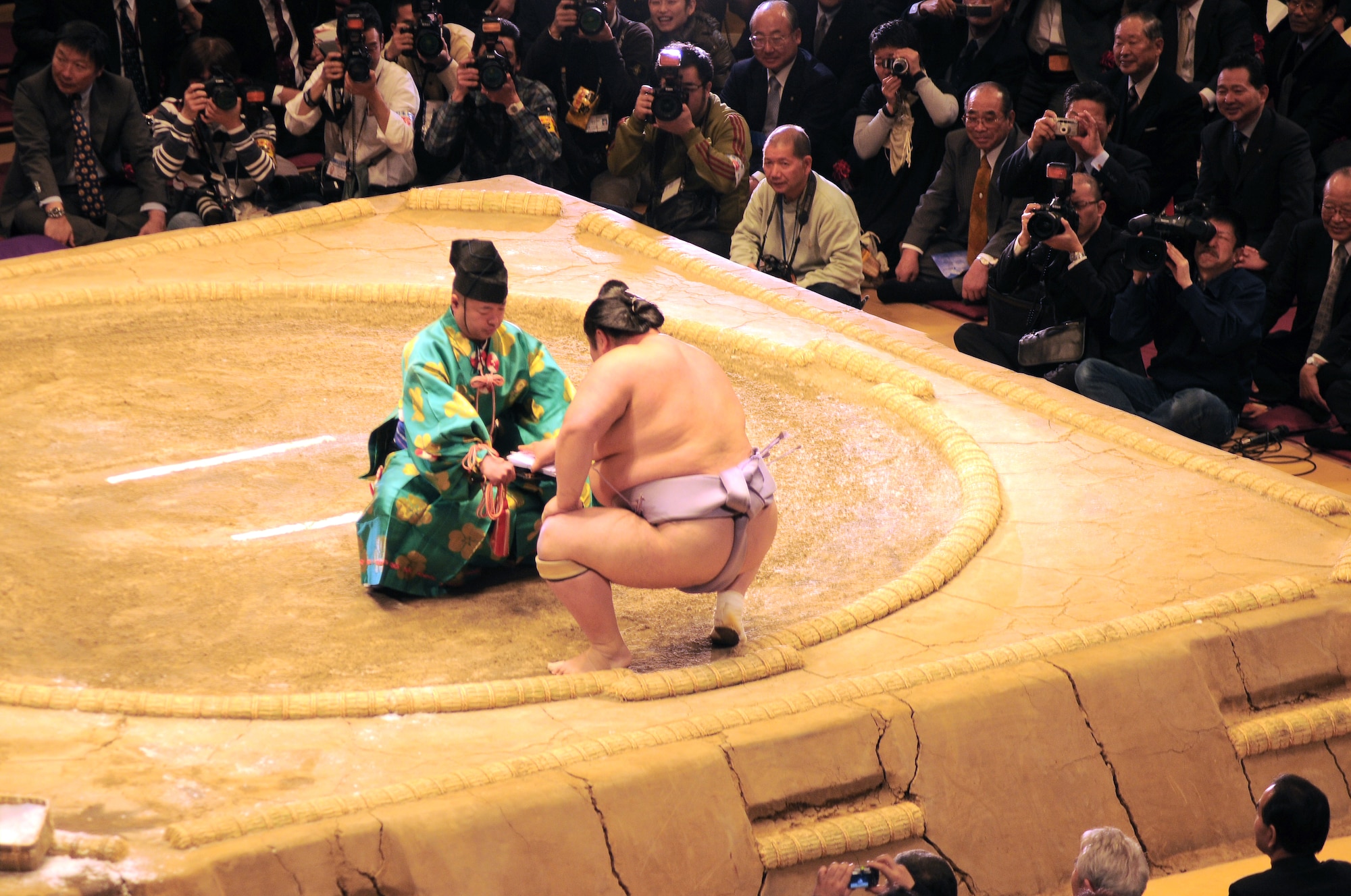 TOKYO -- Ushiomaru Motoyasu receives an award for winning his last sumo match at the Ryogoku Kokugikan "arena" Jan. 31.  Amzumazwki-beya, a local Japanese sumo-training center, invited more than 600 students, parents and teachers from Yokota Air Base to experience this Japanese tradition. (U.S. Air Force photo/Airman 1st Class Katrina Menchaca)