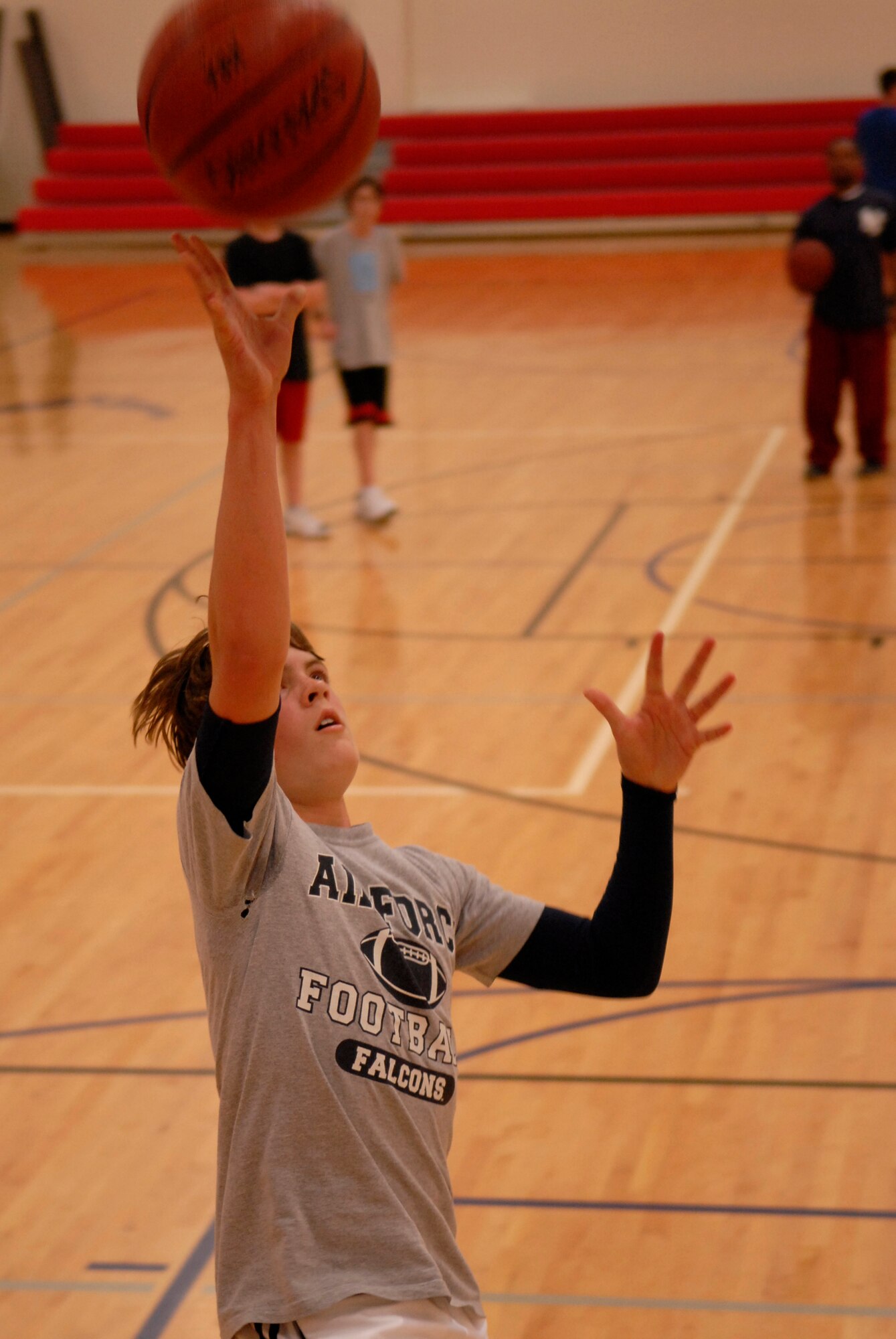 VANDENBERG AIR FORCE BASE, Calif. -- Ben Anderson tosses a ball for a lay-up drill at the Vandenberg Fitness Center on Monday, Feb. 1, 2010.  The Vandenberg recreation senior boys basketball team practice for their upcoming post-season tournament.  (U.S. Air Force photo/Senior Airman Andrew Satran) 

 
 
