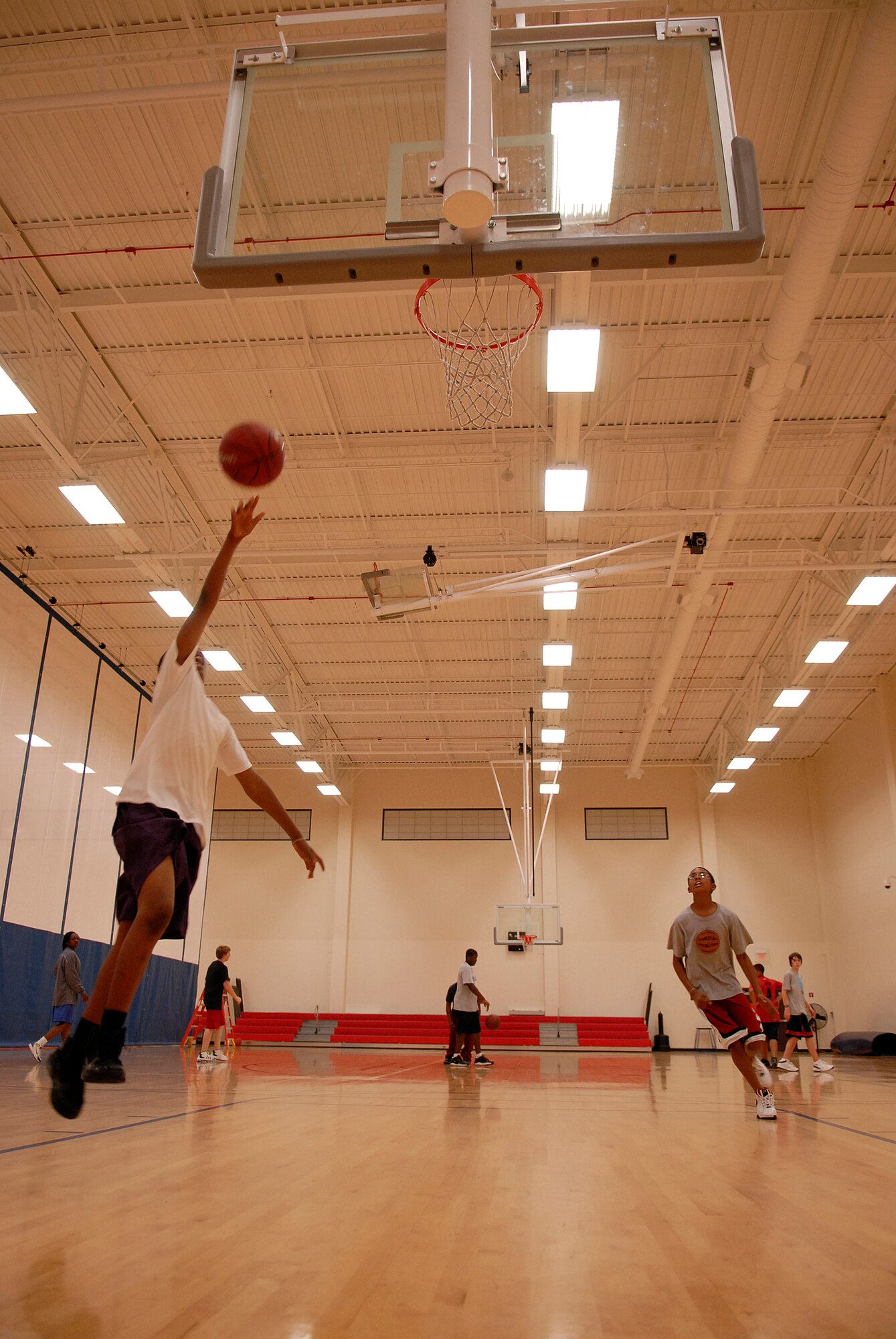VANDENBERG AIR FORCE BASE, Calif. -- Kyleek Fullwood, soars during practice at the Vandenberg Fitness Center on Monday, Feb. 1, 2010.  The Vandenberg recreation senior boys basketball team practice for their upcoming post-season tournament.  (U.S. Air Force photo/Senior Airman Andrew Satran) 

 