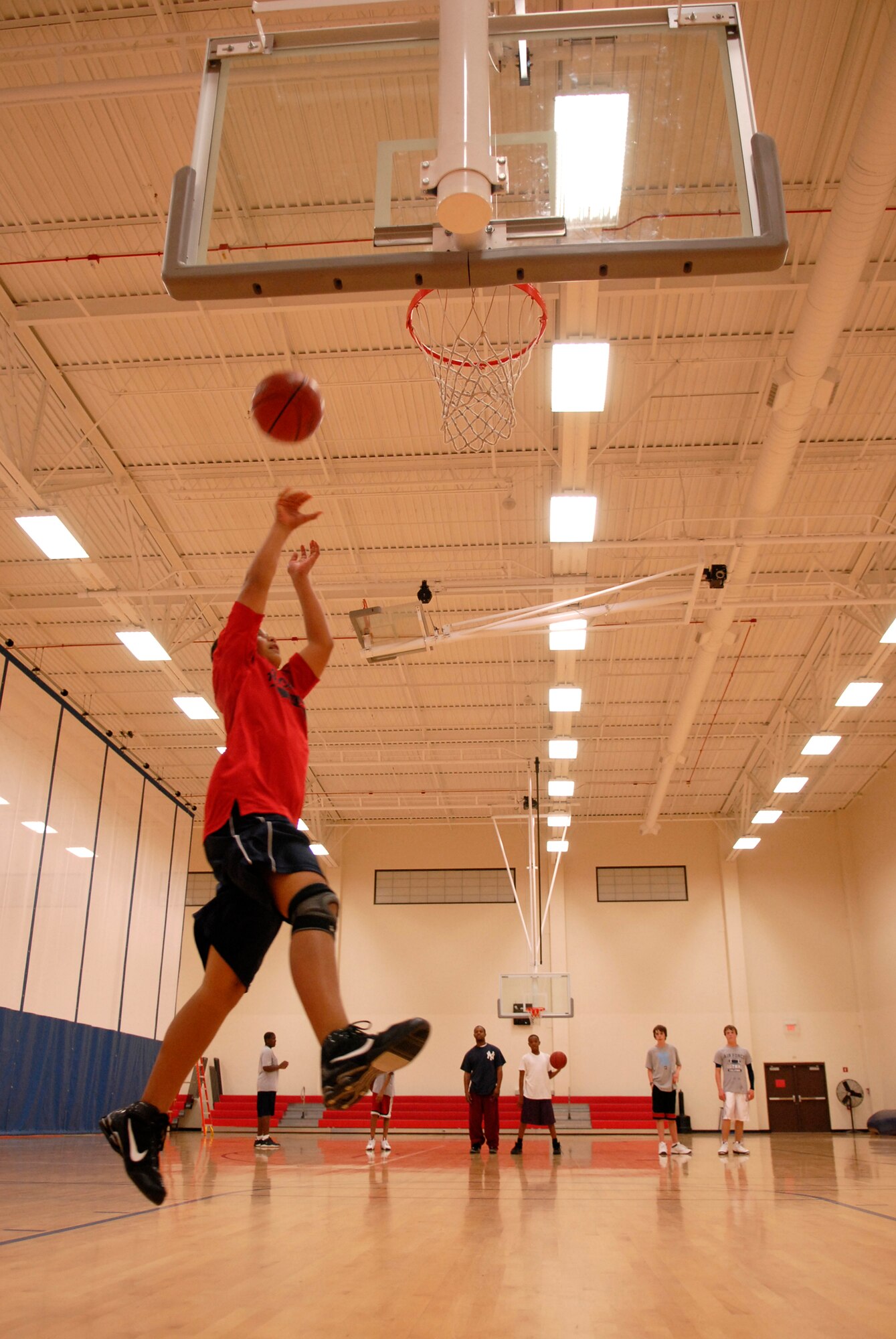 VANDENBERG AIR FORCE BASE, Calif. -- Lavanson Coffey leaps for a lay-up during practice on the Vandenberg Fitness Center on Monday, Feb. 1, 2010.  The Vandenberg recreation senior boys basketball team practice for their upcoming post-season tournament.  (U.S. Air Force photo/Senior Airman Andrew Satran) 

 