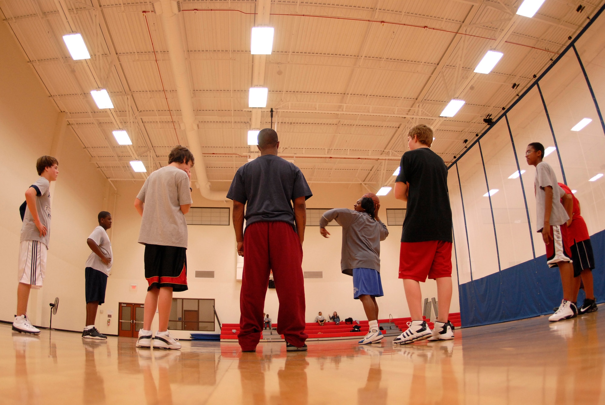 VANDENBERG AIR FORCE BASE, Calif. --  Lakyshia Fullwood instructs and motivates the Vandenberg recreation  senior boys basketball team during practice Monday, Feb. 1, 2010.  Winning the last four out of five games, the senior boys prepared for their post-season tournament.  (U.S. Air Force photo/Senior Airman Andrew Satran) 
 
 