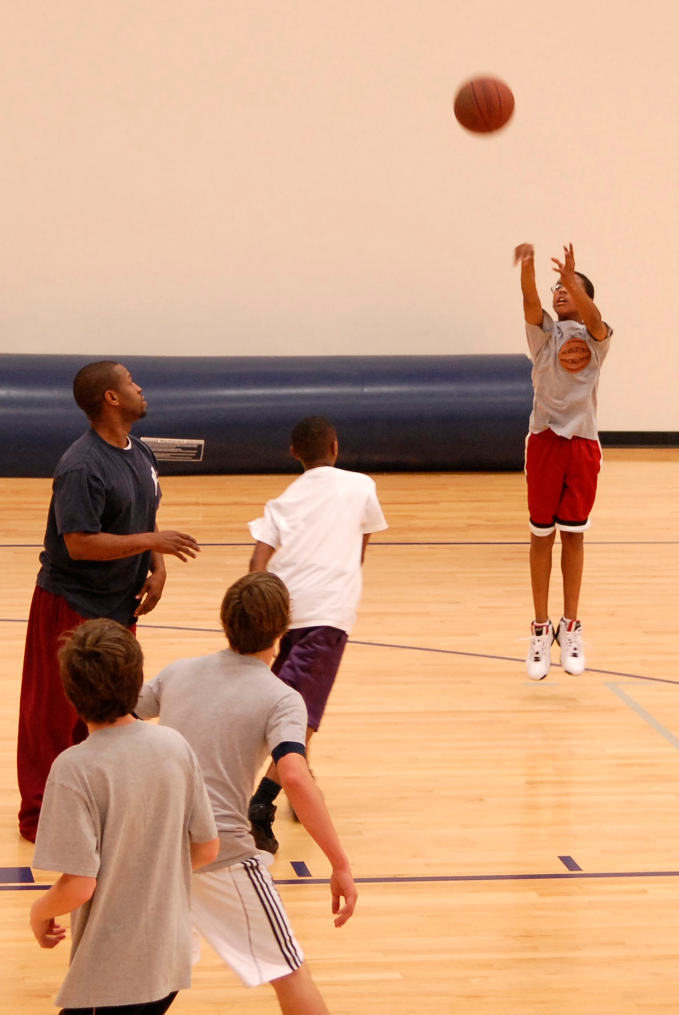 VANDENBERG AIR FORCE BASE, Calif. -- Deshawn Bowen shoots a two-point shot during practice at the Vandenberg Fitness Center Monday, Feb. 1, 2010.   Vandenberg's senior boys basketball team, grades seven through eight, is preparing to enter a post-season tournament. (U.S. Air Force photo/Senior Airman Andrew Satran) 

 
 
