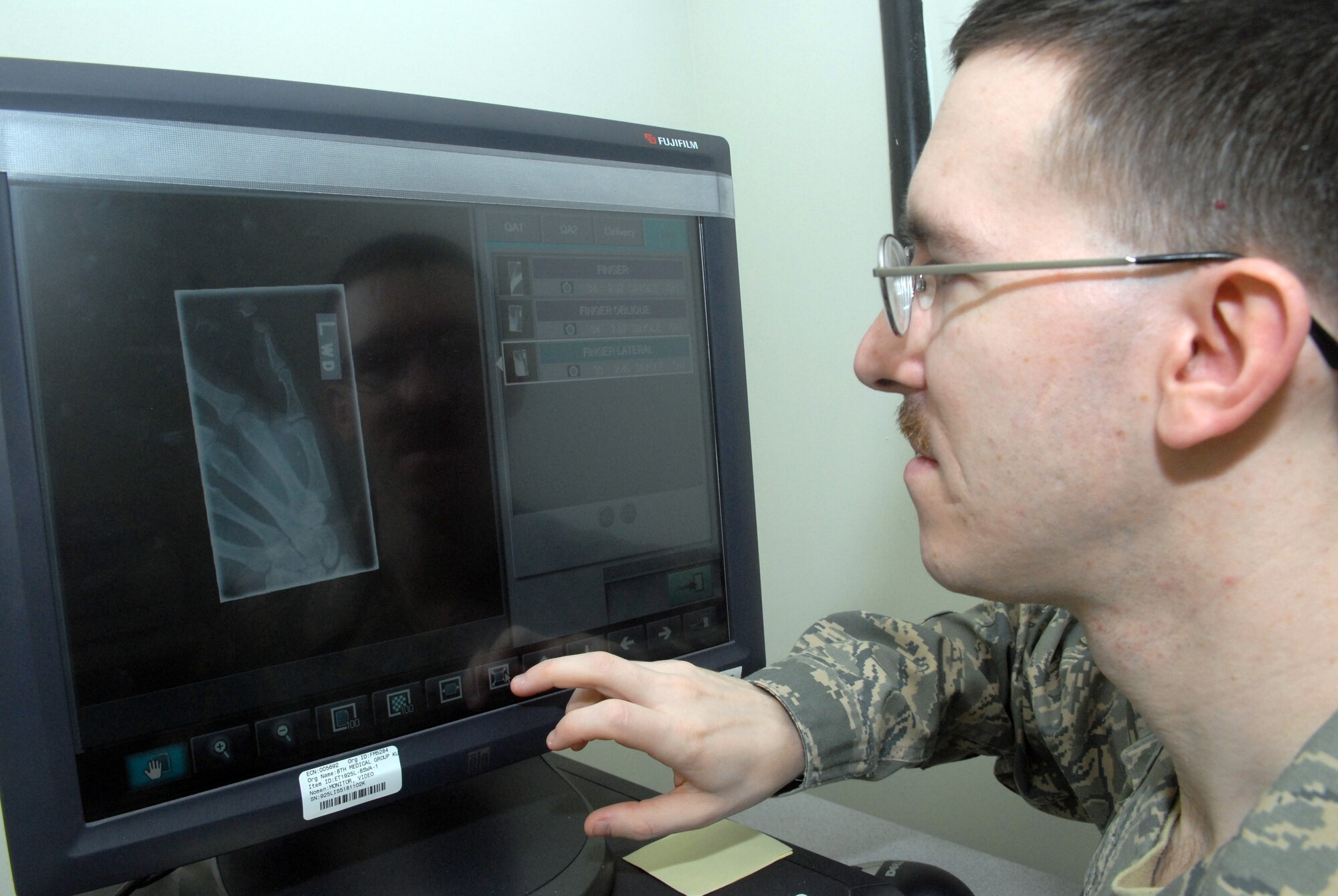 KUNSAN AIR BASE, Republic of Korea -- Staff Sgt. Joseph Mooney, 8th Medical Support Squadron diagnostic imaging technician, views a digital X-ray at the base clinic Feb. 4. Kunsan Diagnostic Imaging Technicians operate fixed and portable diagnostic image equipment to produce routine diagnostic medical images. (U.S. Air Force photo/Senior Airman Roy Lynch)