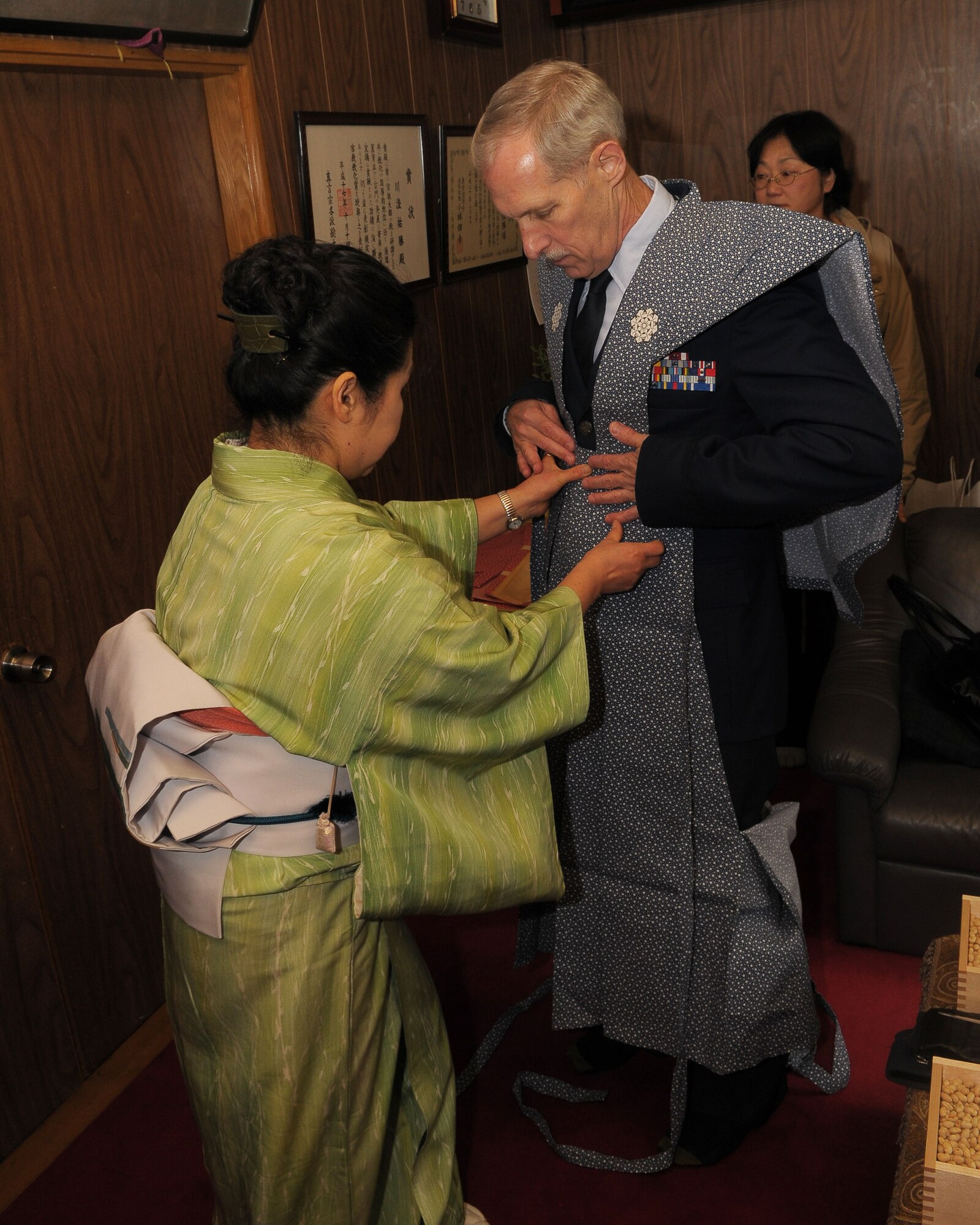 HINO, Japan -- Col. Thomas Grimm, 374th Dental Squadron commander, puts on a "Kamishimo," a formal piece of clothing worn by a samurai or a Japanese warrior, during the bean throwing ceremony at Takahata Fudo Temple Feb. 3. During the ceremony, people throw roasted soybeans while shouting "Fu ku wa uchi" which means, "Come in happiness". It is believed that if you eat the number of beans equal to your age, you will have a happy and healthy life. (U.S. Air Force photo/Airman 1st Class Sean Martin)